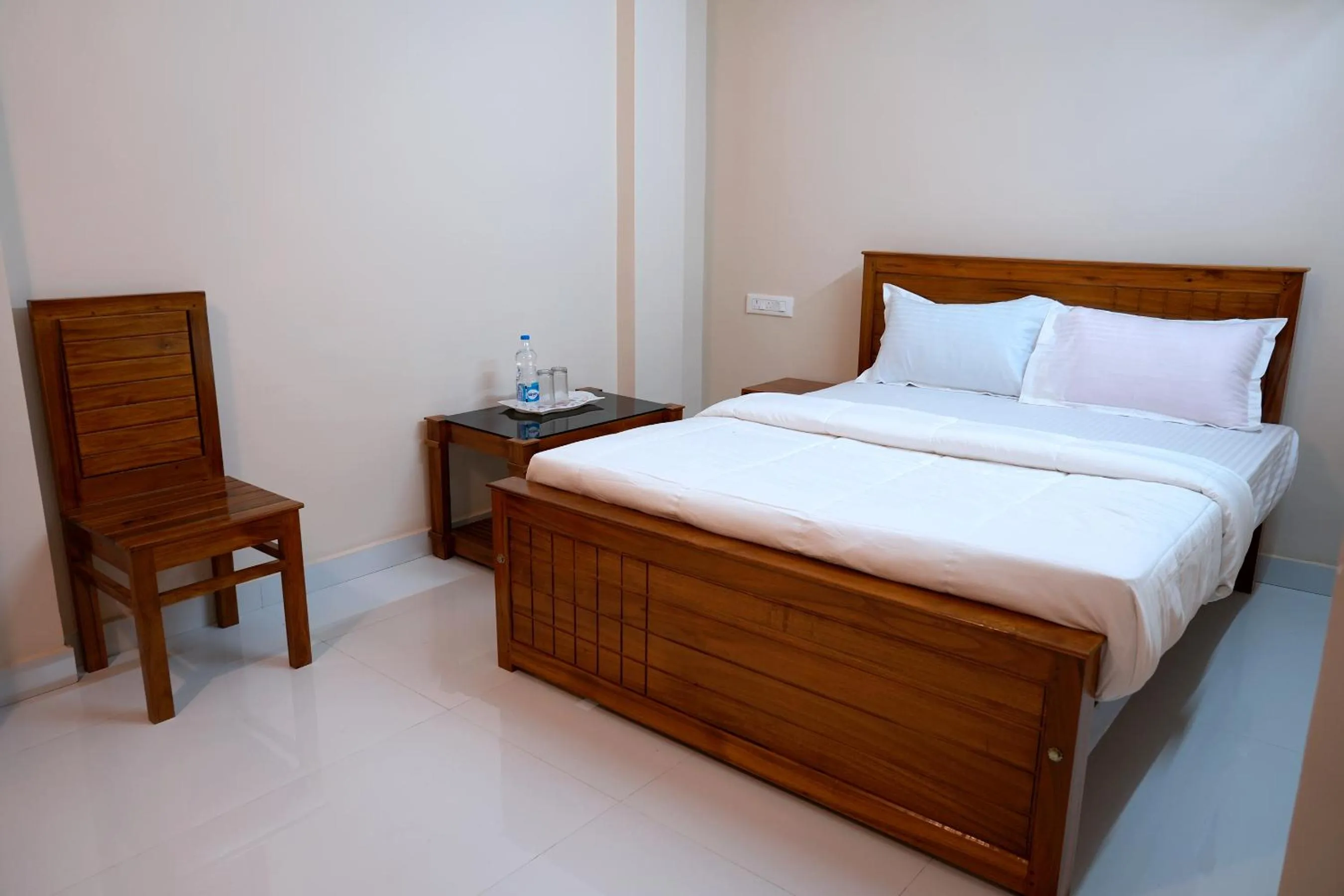 Bed in HILL PALACE RESIDENCY COORG