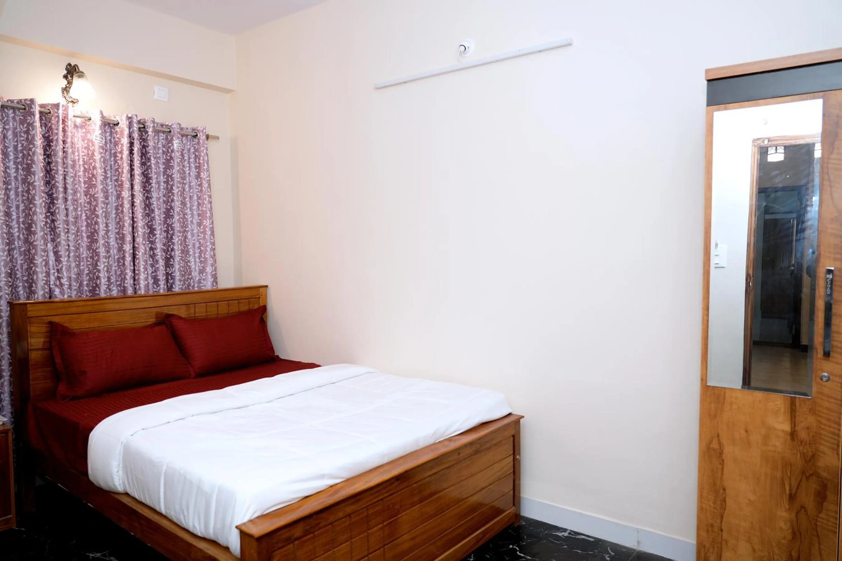 Bed in HILL PALACE RESIDENCY COORG