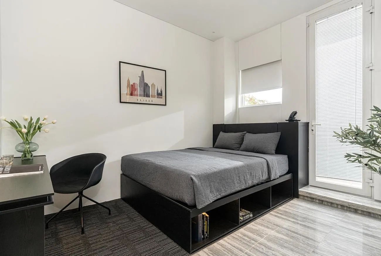 Photo of the whole room, Bed in M Village Nguyễn Kiệm - Cosmo Airport Hotel