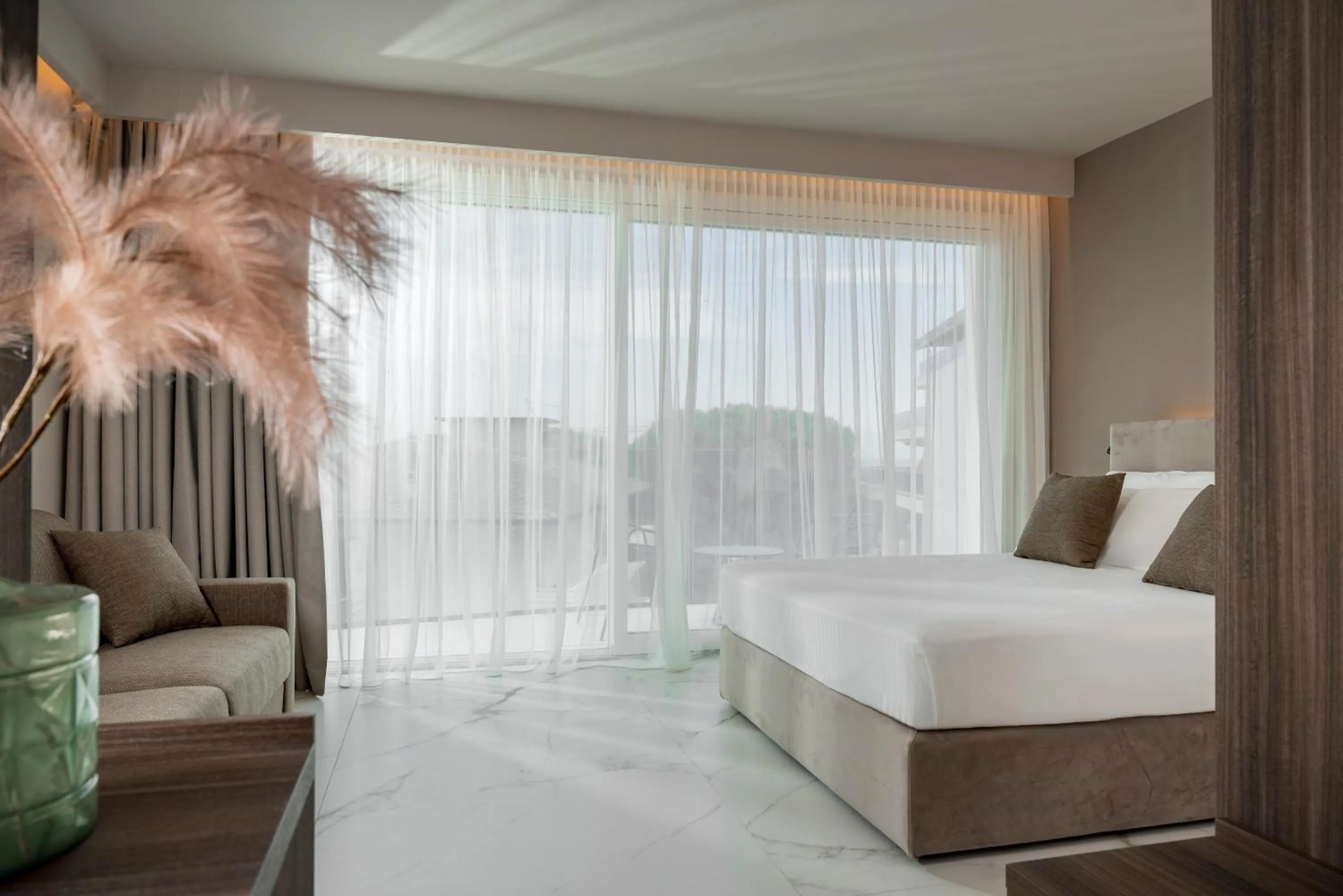 Bed in Bolina Suite & Spa