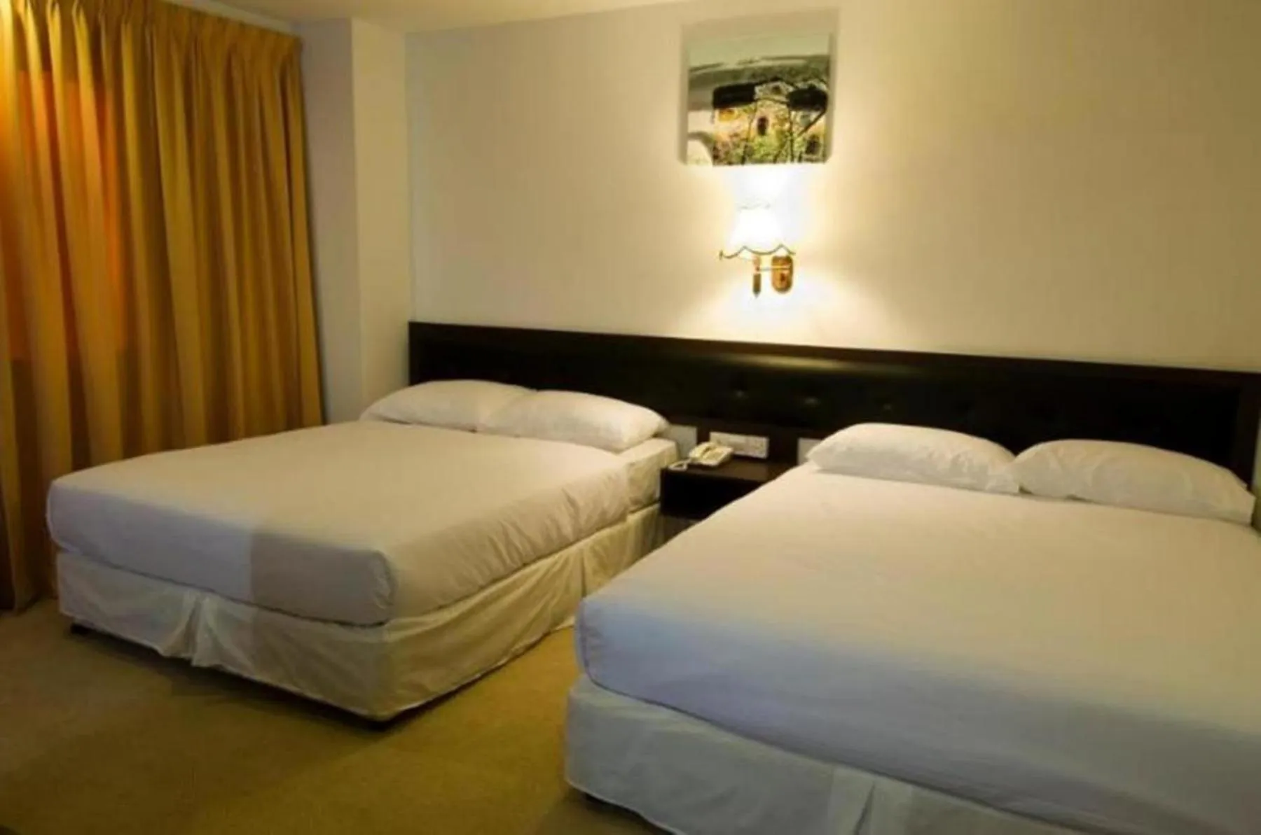 Bed in Syaz Meridien Hotel