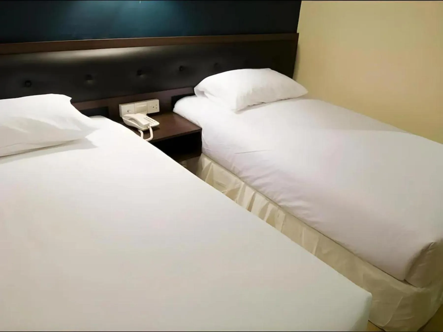 Bed in Syaz Meridien Hotel