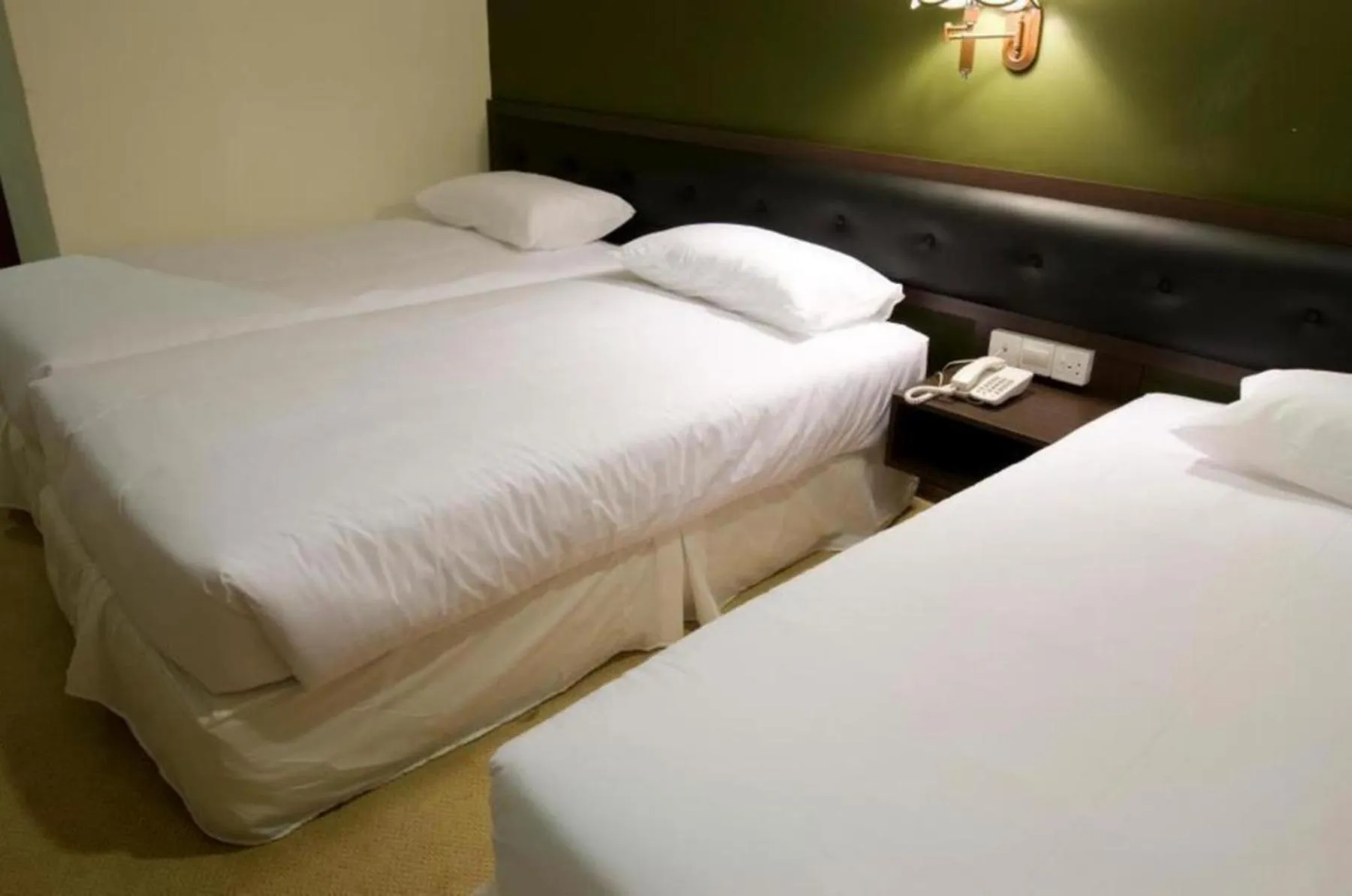 Bed in Syaz Meridien Hotel