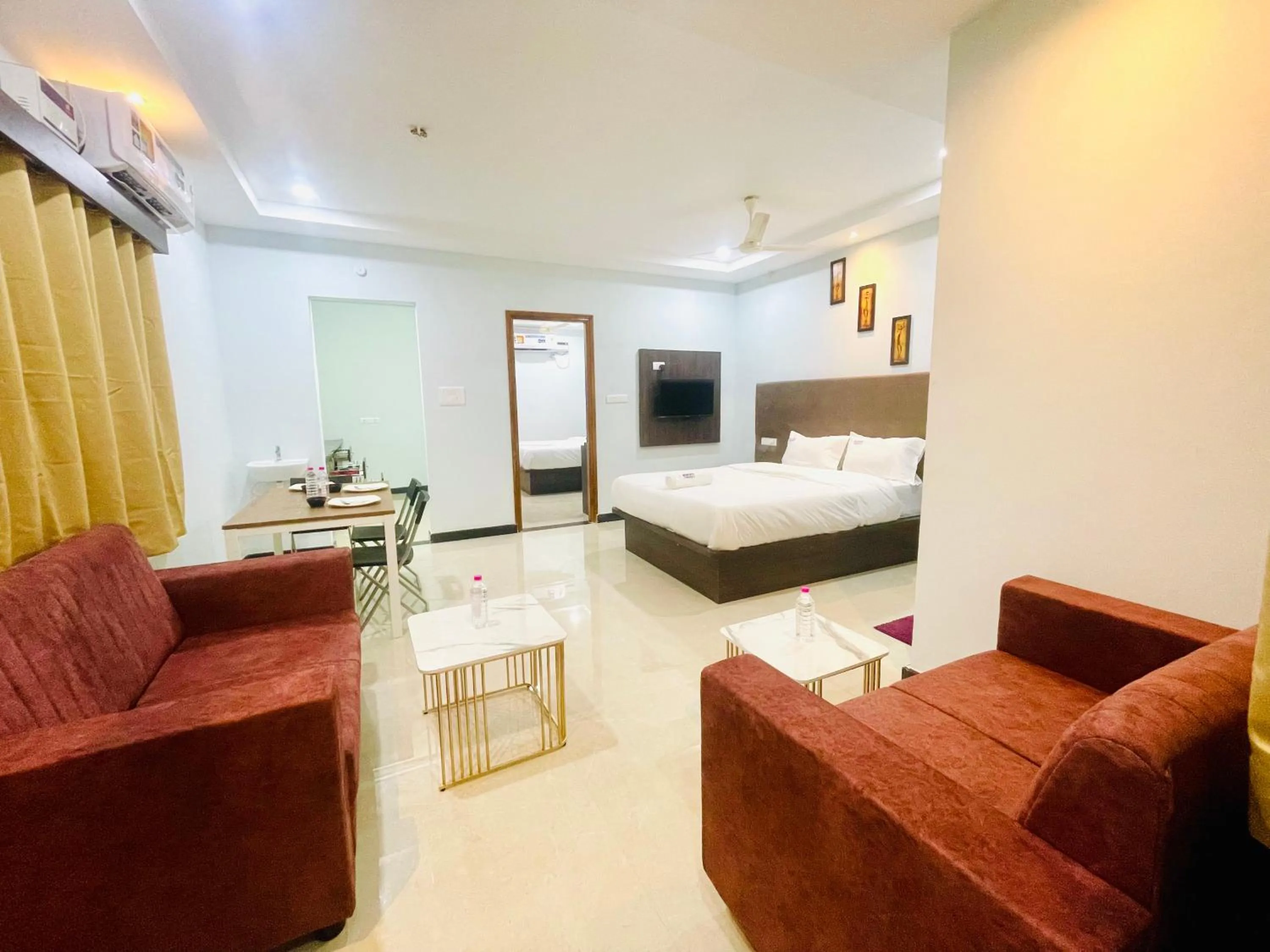 Communal lounge/ TV room, Bed in Deccan Suites, Tirupati