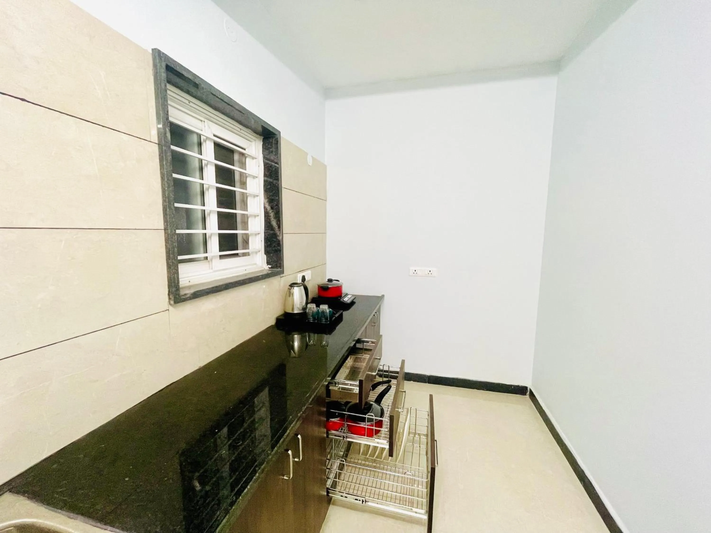 Kitchen or kitchenette in Deccan Suites, Tirupati