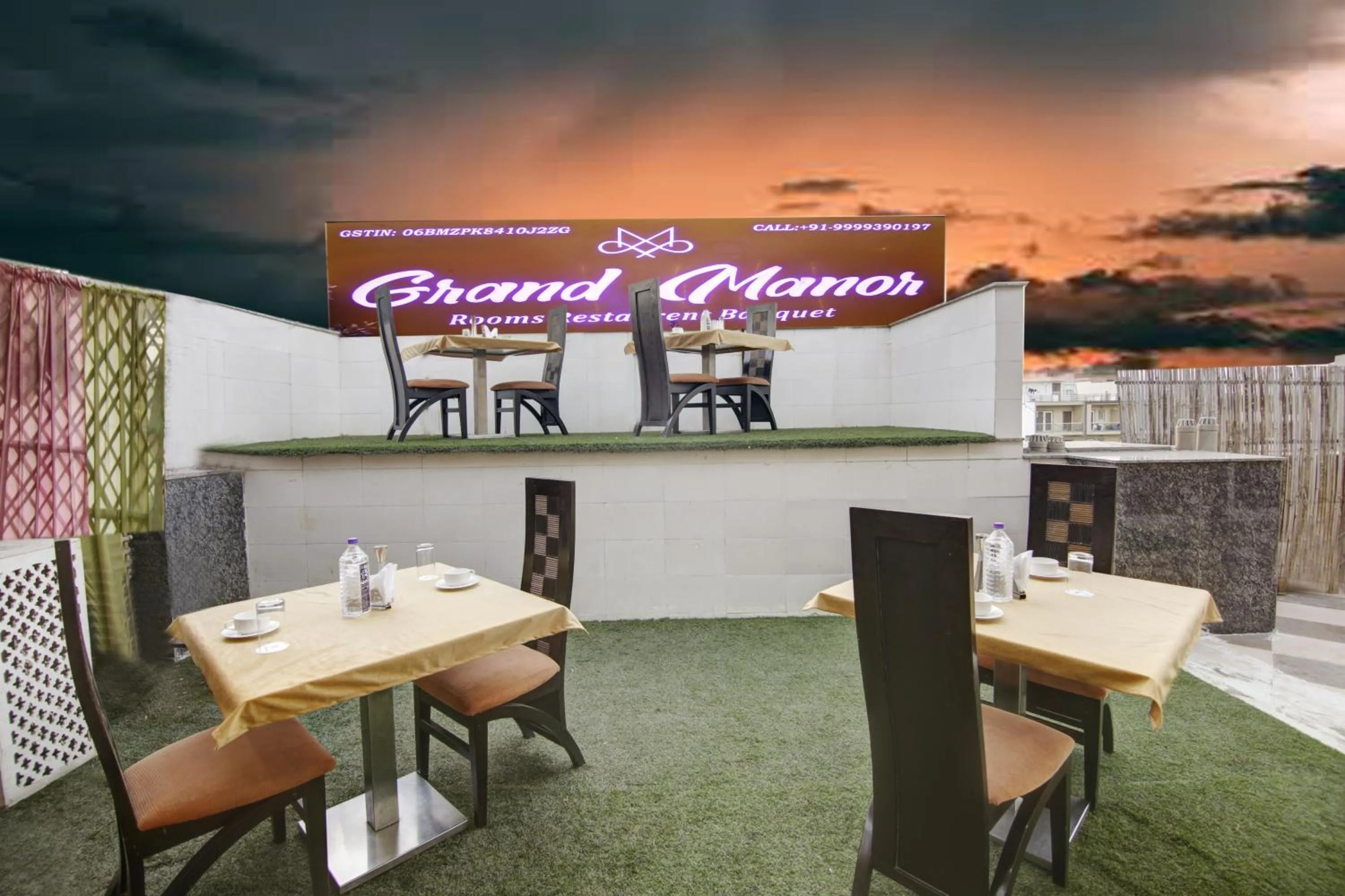 Property logo or sign in Hotel Grand Manor