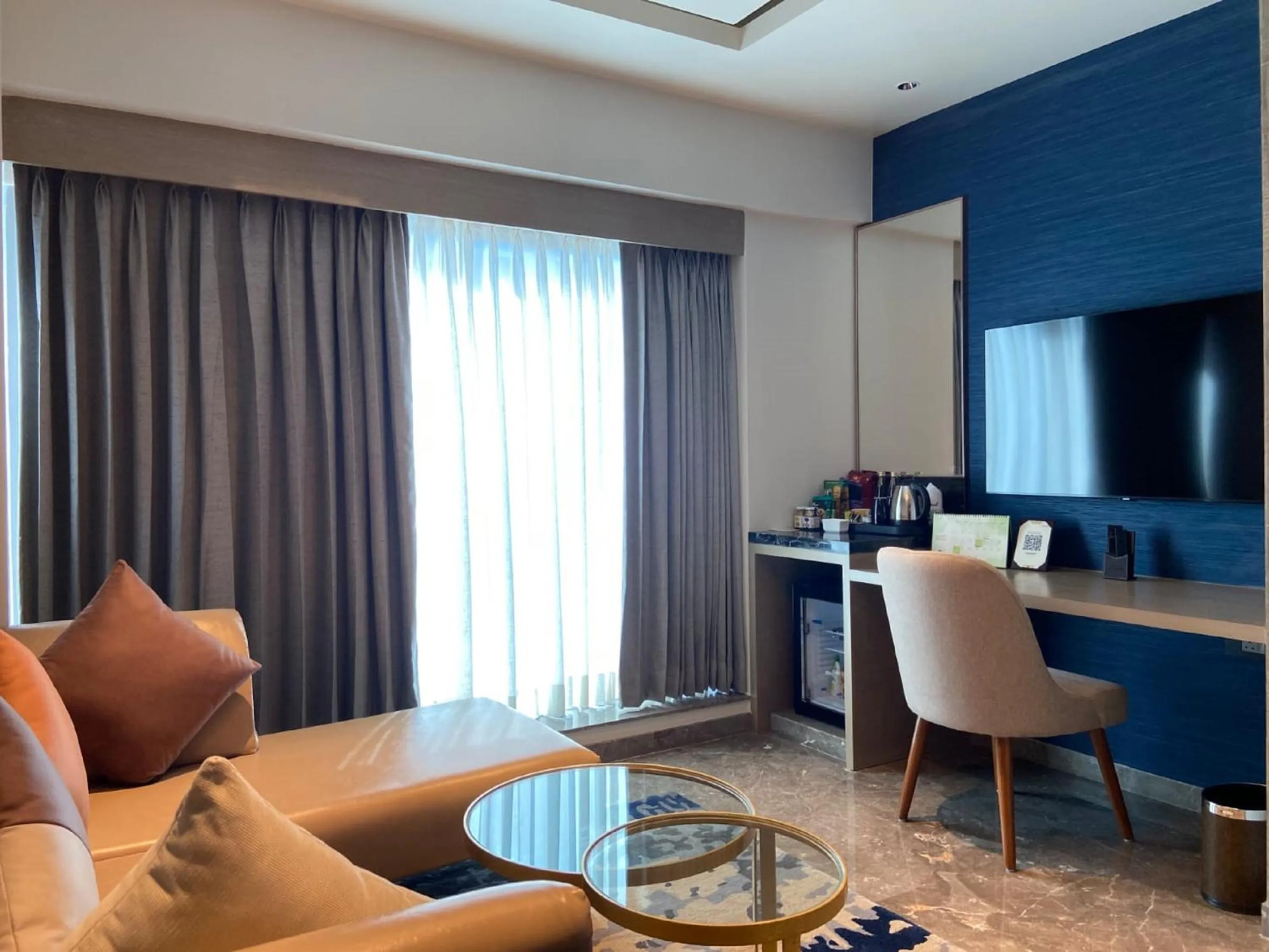 Living room in Grand Madurai by GRT Hotels