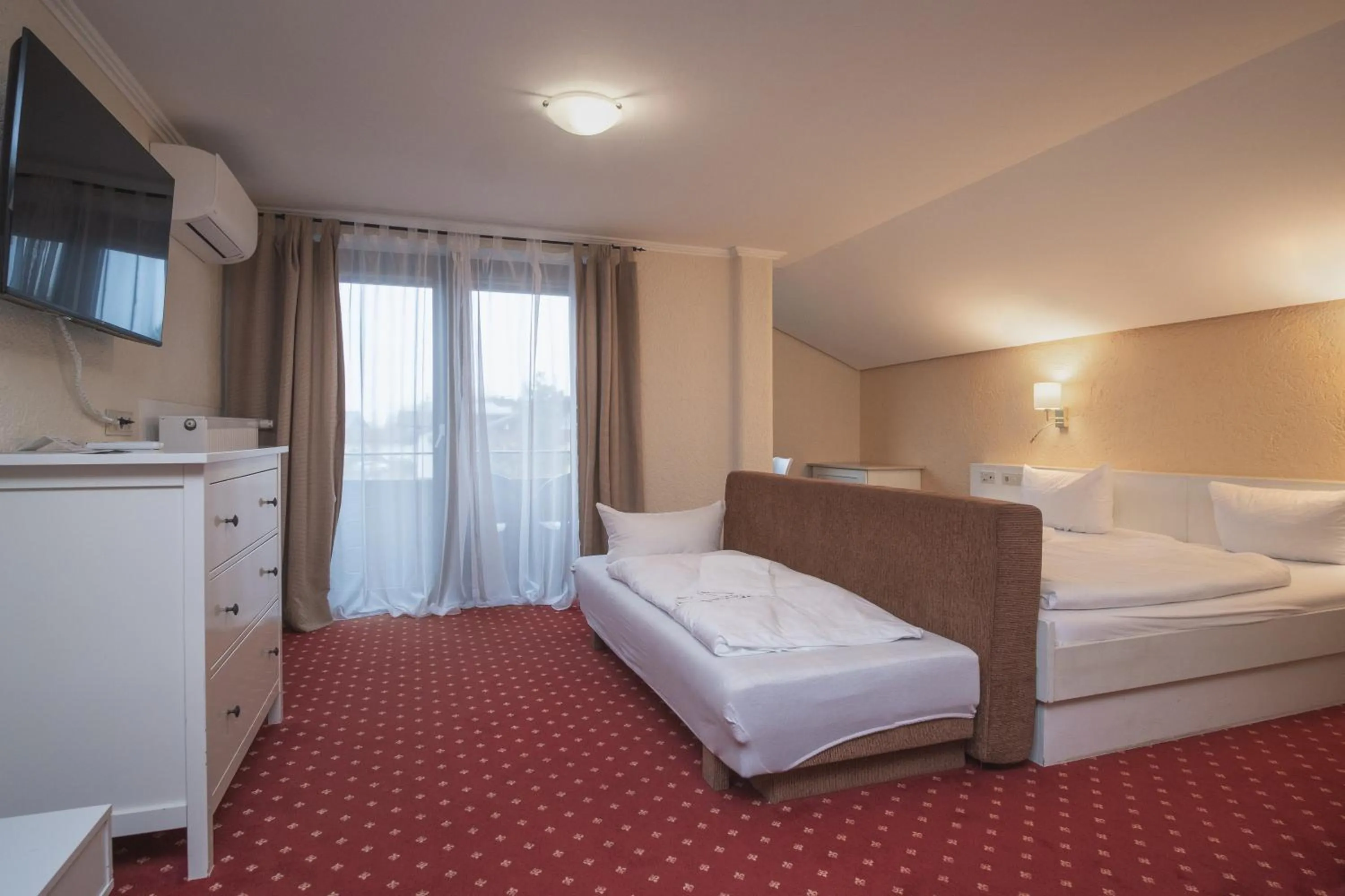 Photo of the whole room, Bed in Trail Hotel Oberstaufen