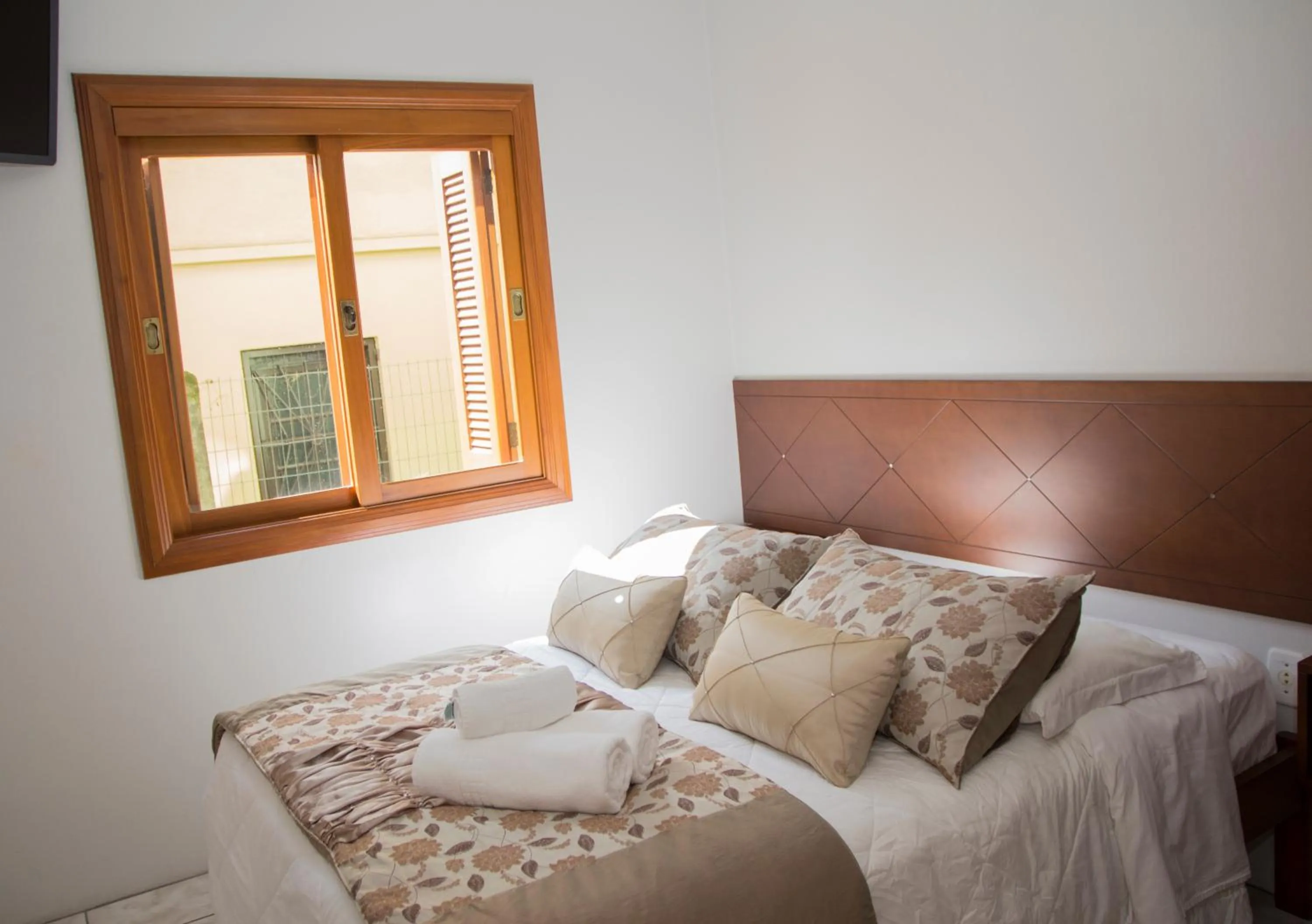 Bed in Pousada Caminho dos Plátanos