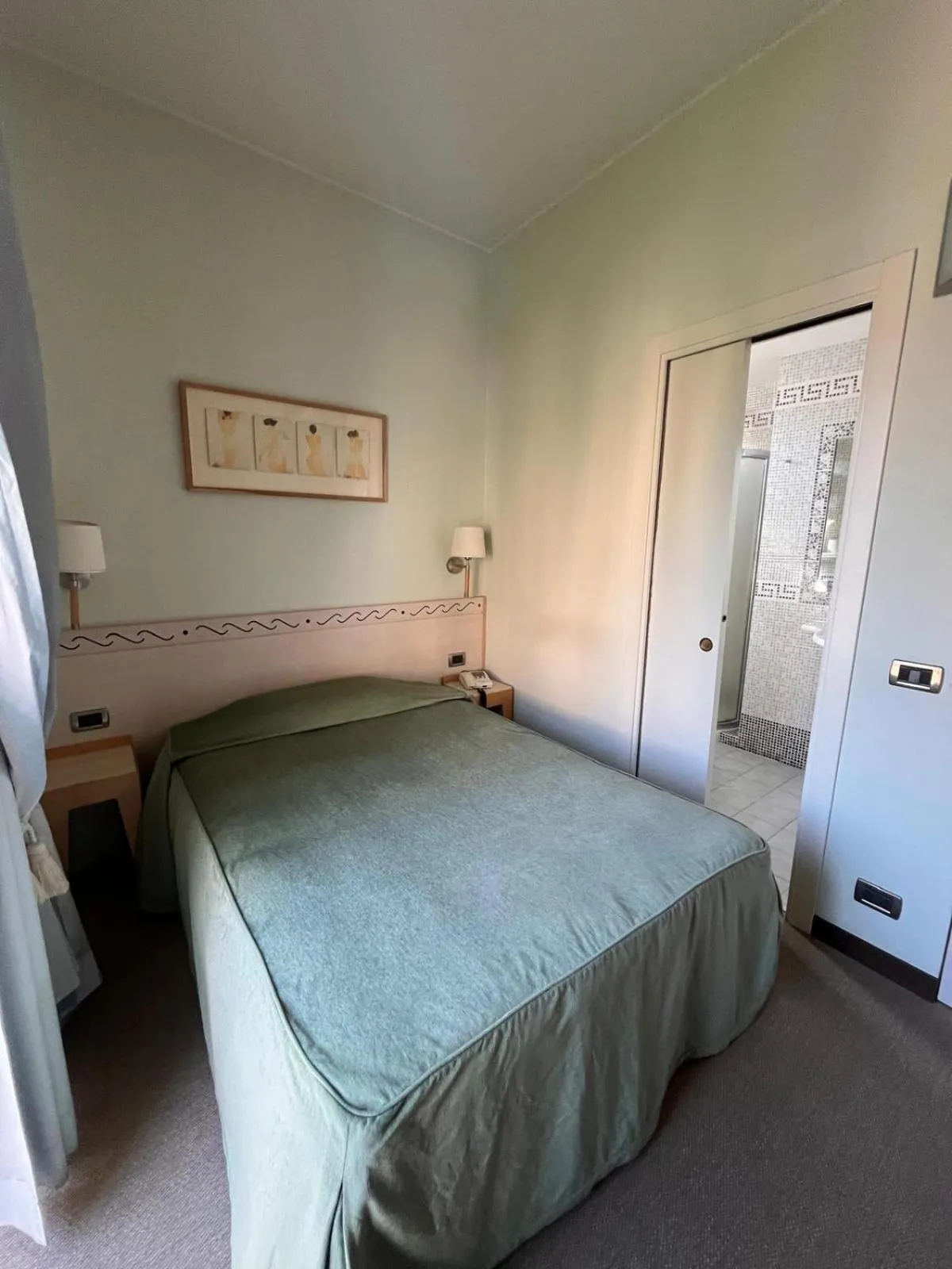 Bed in HOTEL LUDOVICO ARIOSTO