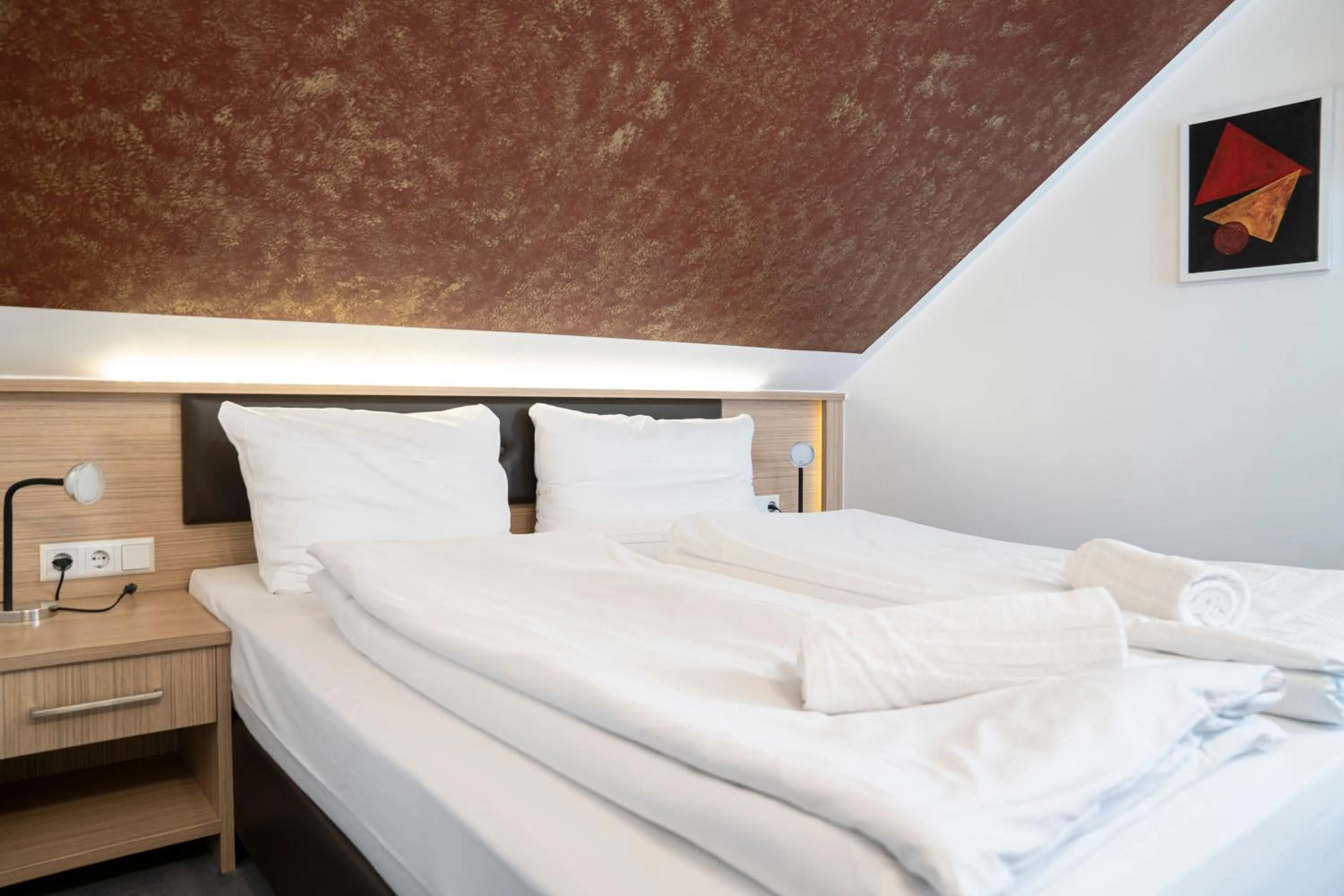 Bed in Alpha & Omega Hotel Stuttgart