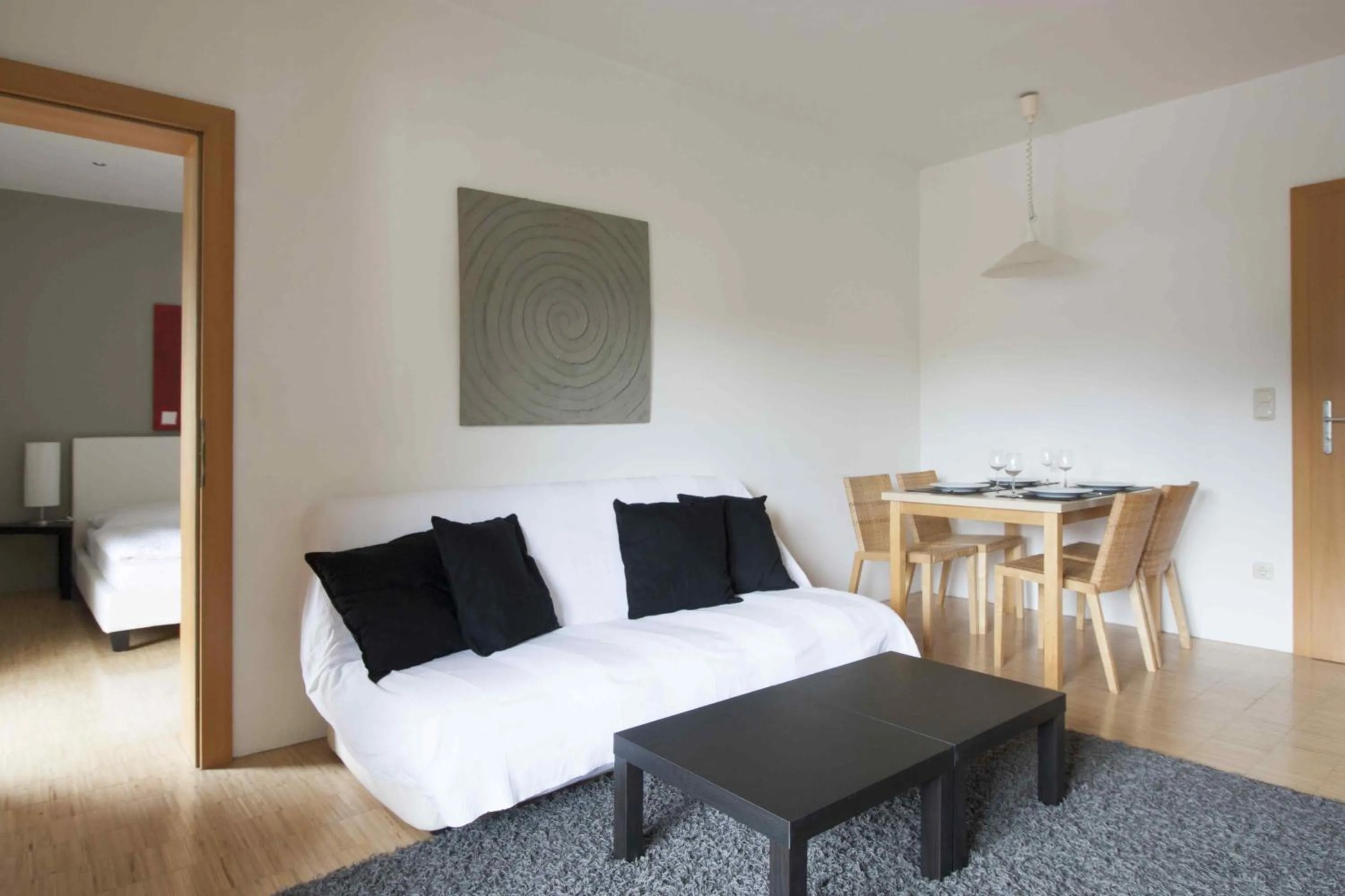 Living room, Bed in Appartements Christophorus