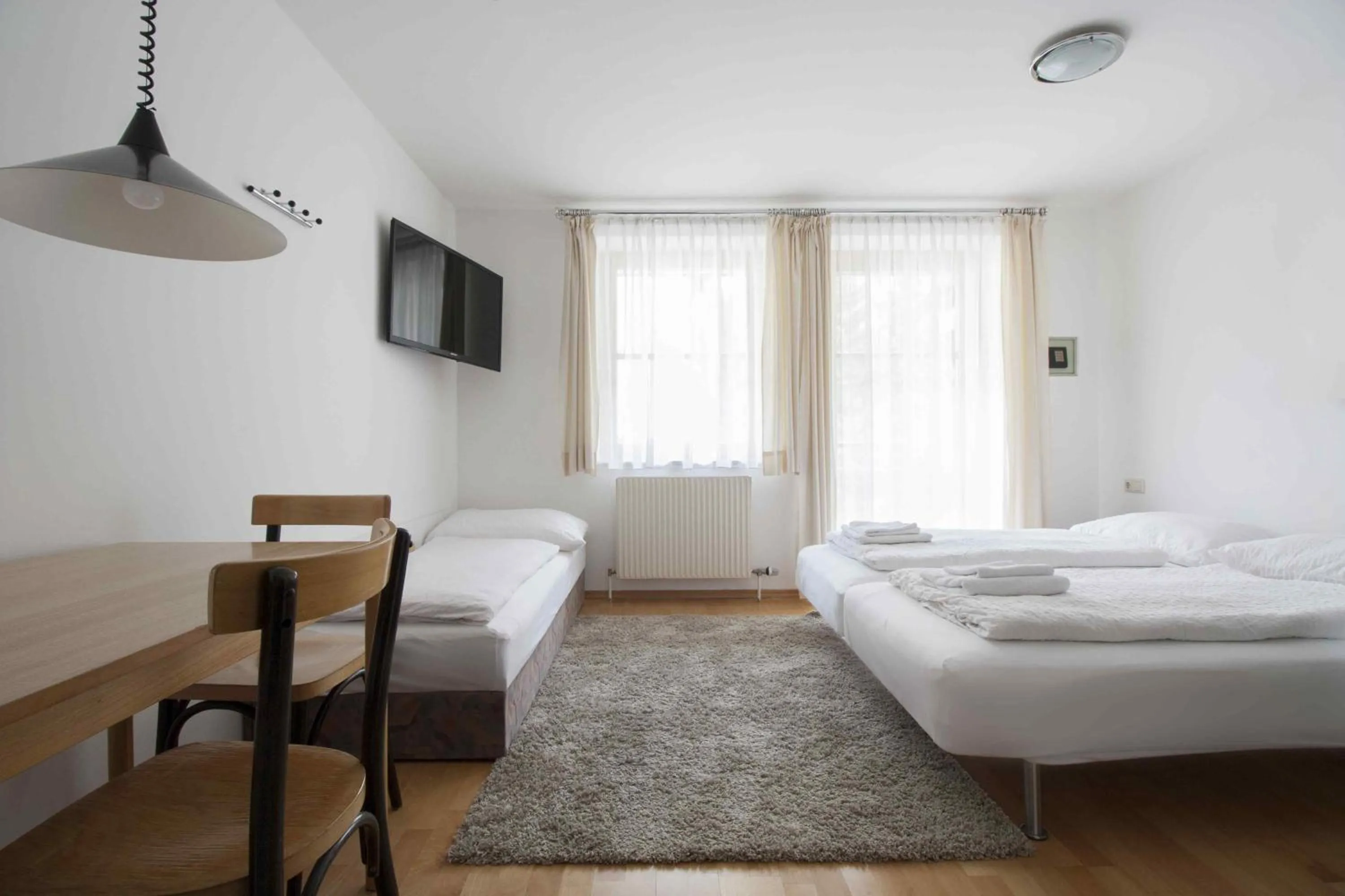 Living room, Bed in Appartements Christophorus