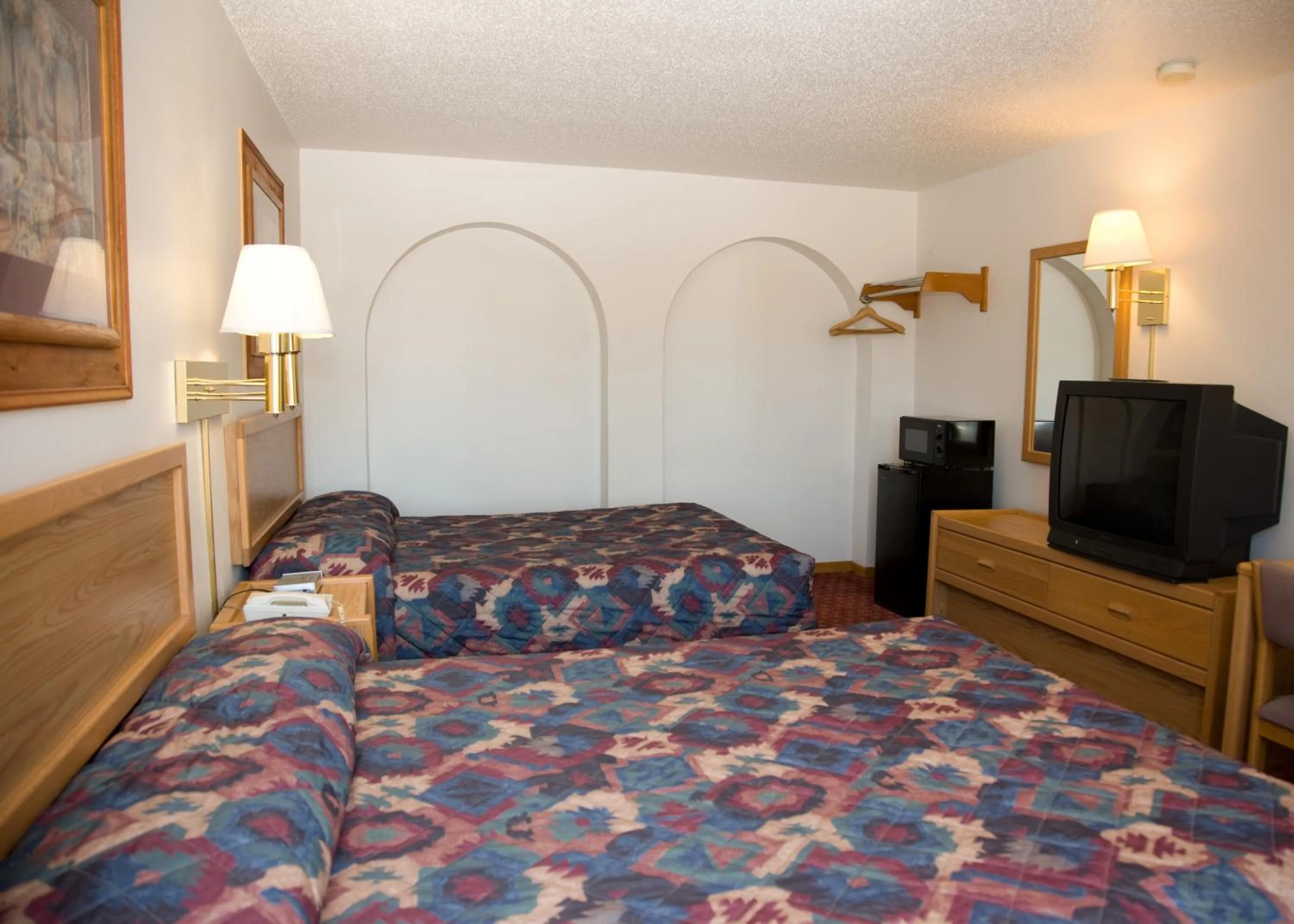 Bed in North Country Inn & Suites