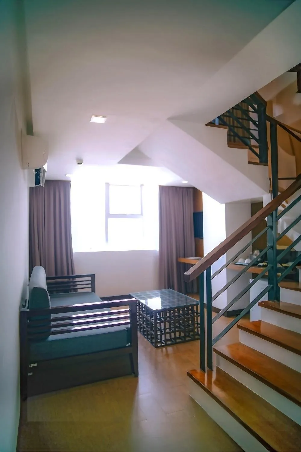 Living room, Bed in The Harvest Hotel Managed by HII