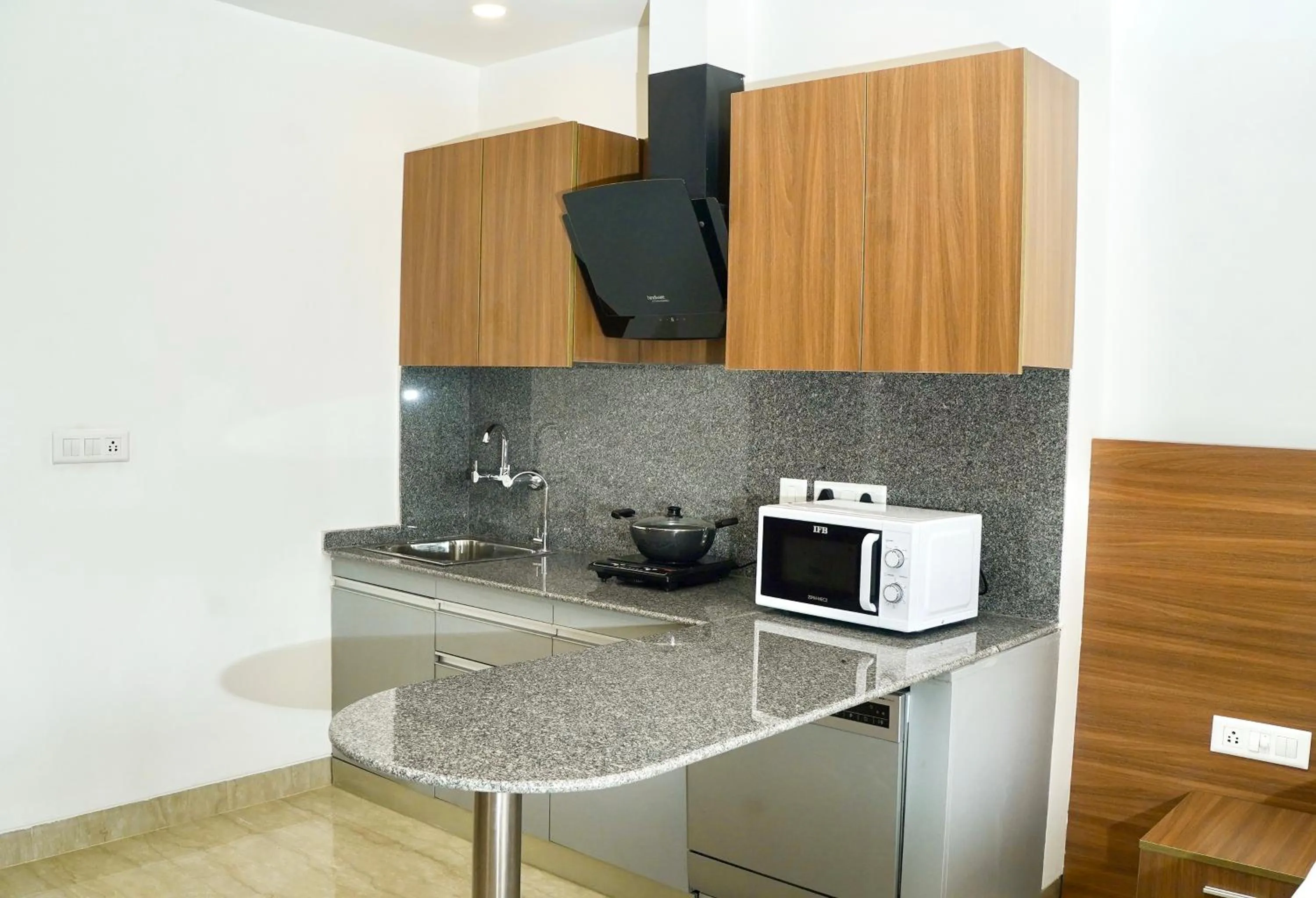 Kitchen or kitchenette in Alivaa Hotel Gurugram Sohna Road City Center