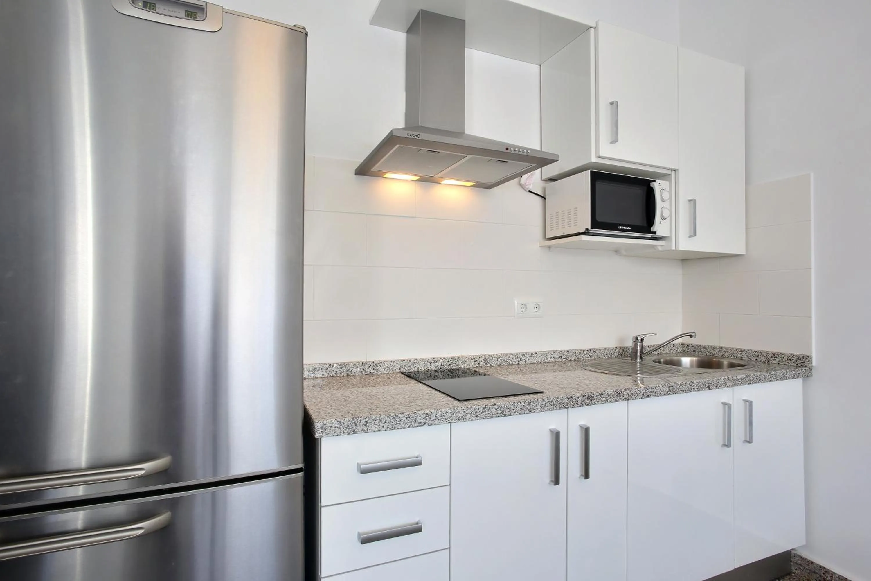 Kitchen or kitchenette in Apartamentos Ronda Luz