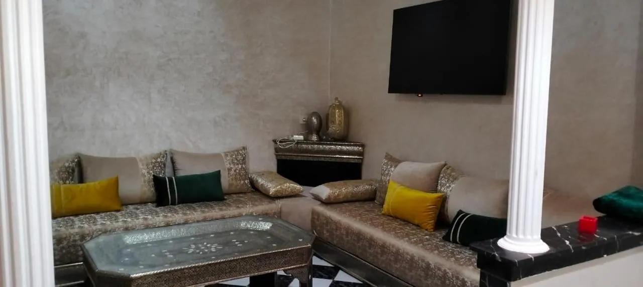 Communal lounge/ TV room in Riad Aya