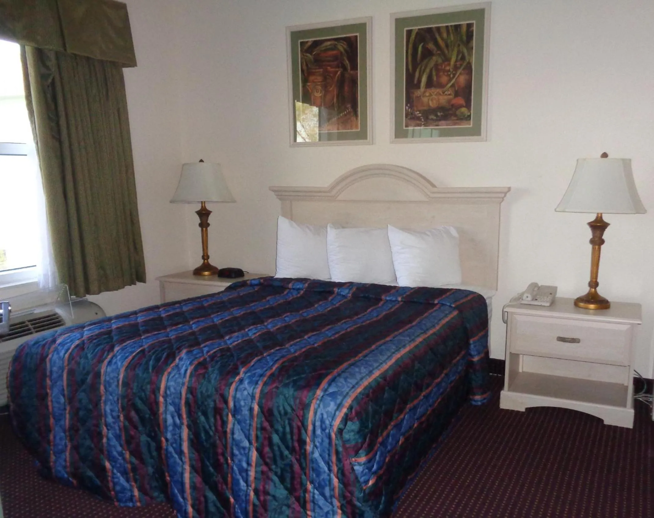 Bed in Allure Suites of Fort Myers