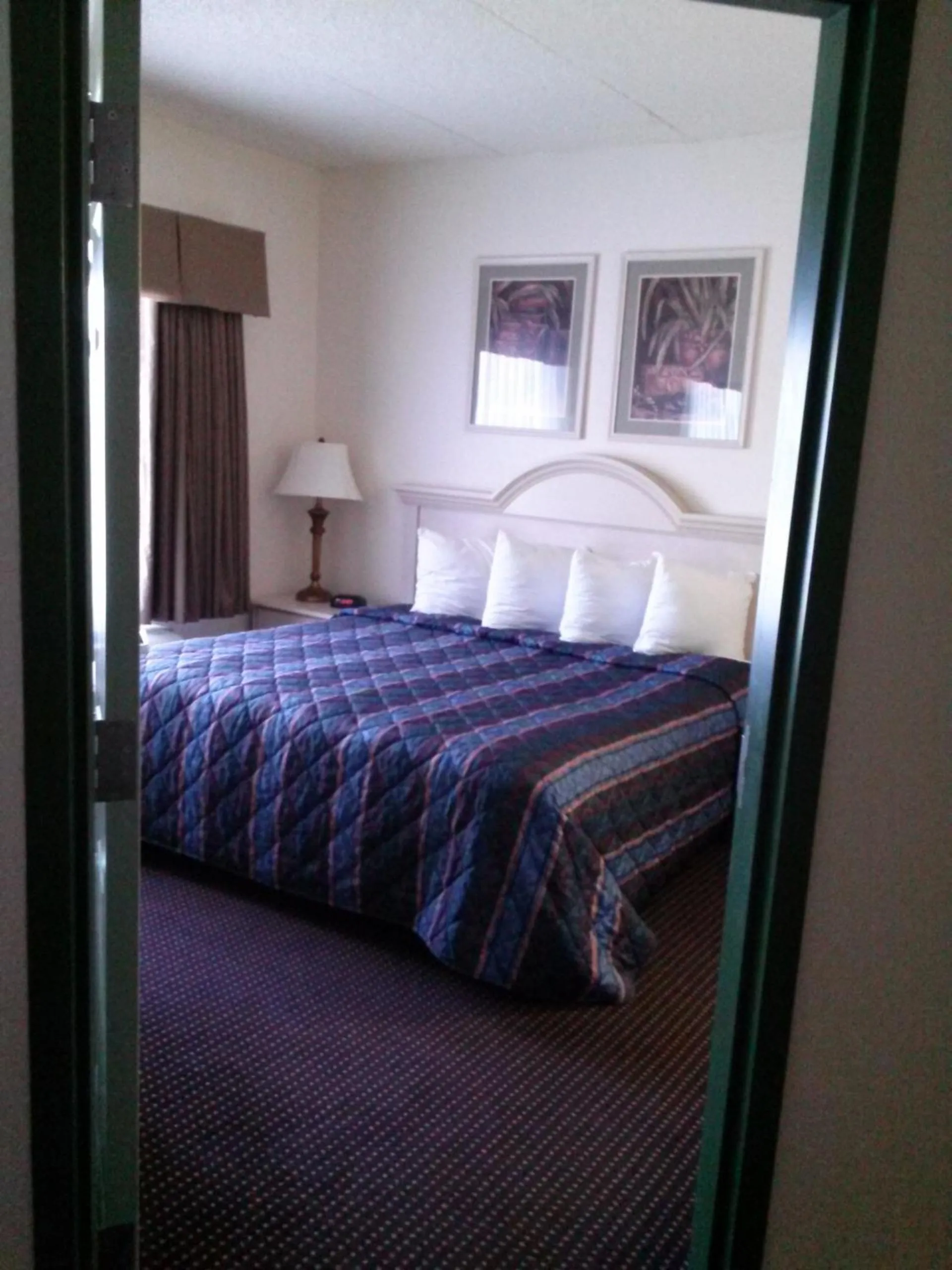 Bed in Allure Suites of Fort Myers