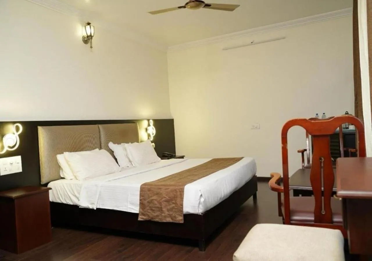 Bed in Malanadu Tourist Home