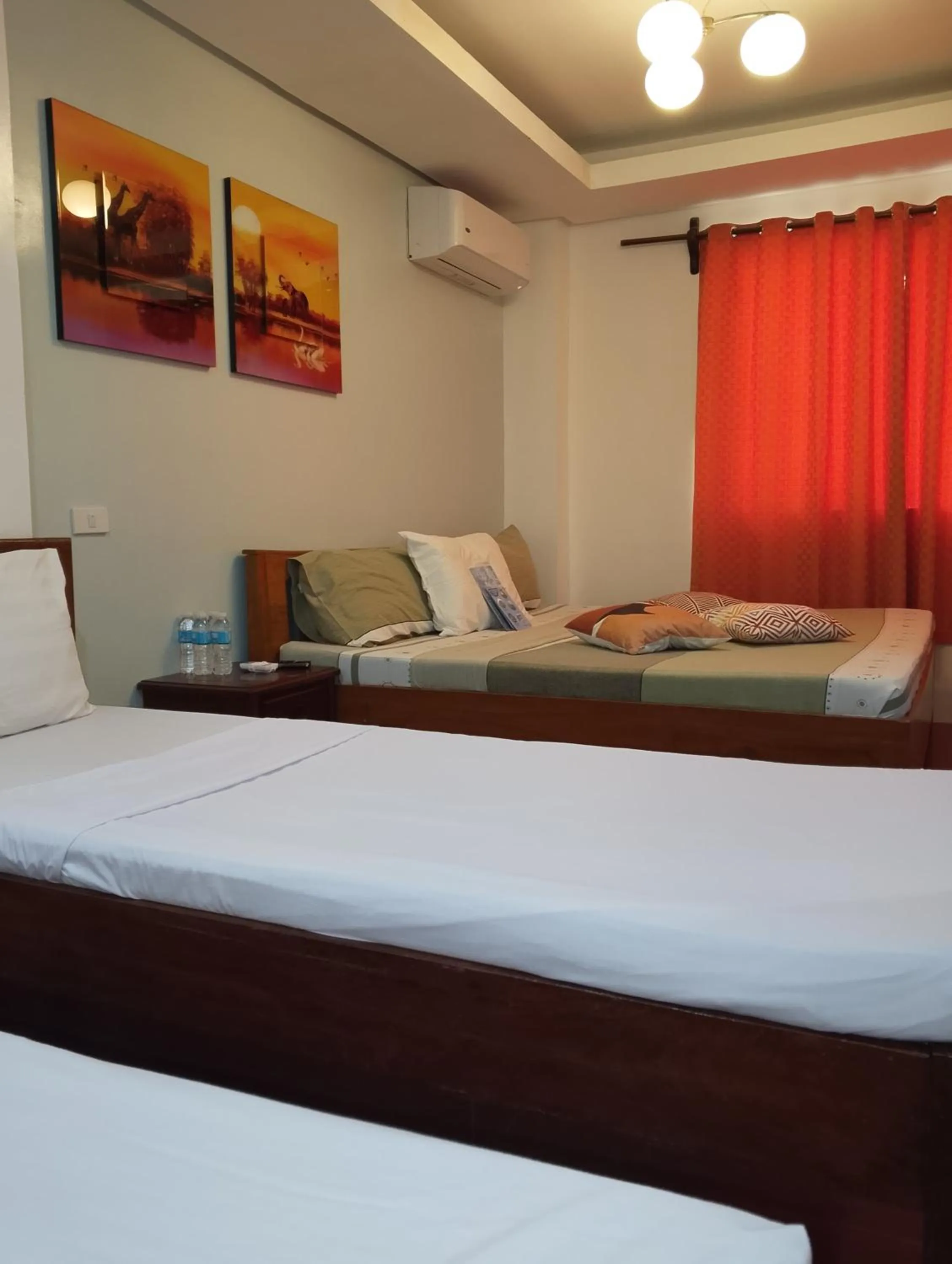 Bed in Aqua Travel Lodge