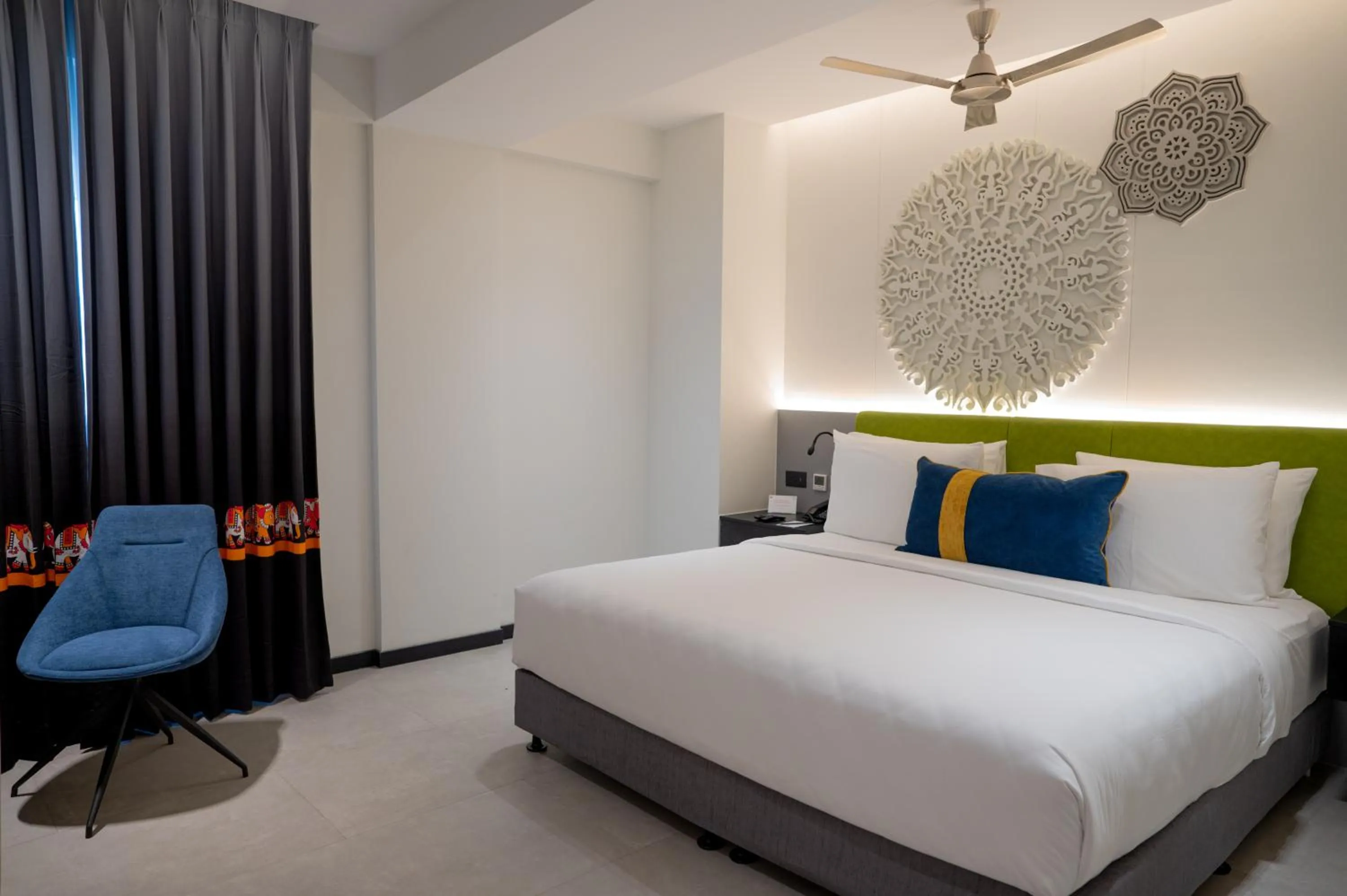 Photo of the whole room, Bed in ZIBE Luxe Kakinada by GRT Hotels