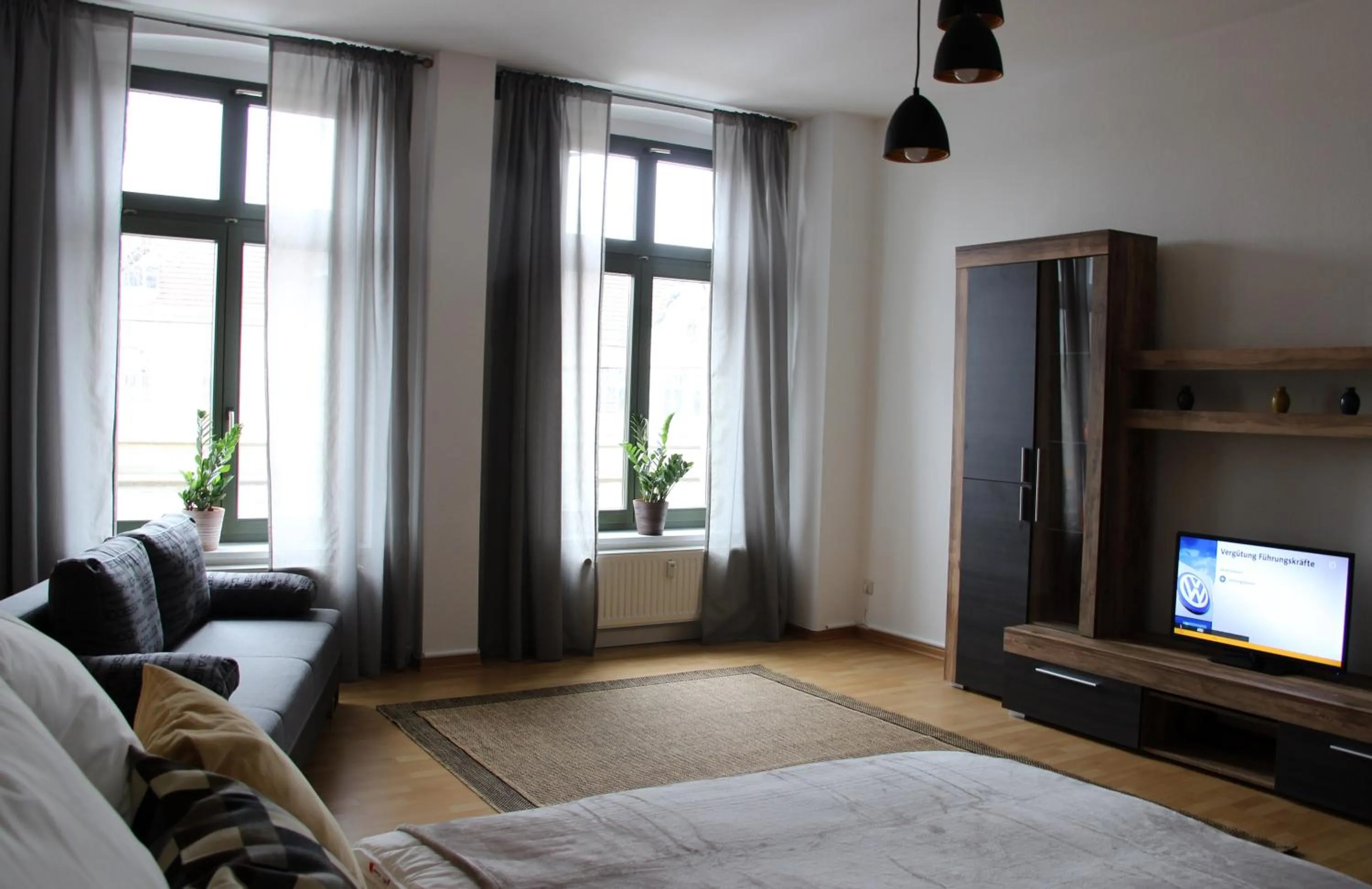 Living room, Bed in Leon Apartments