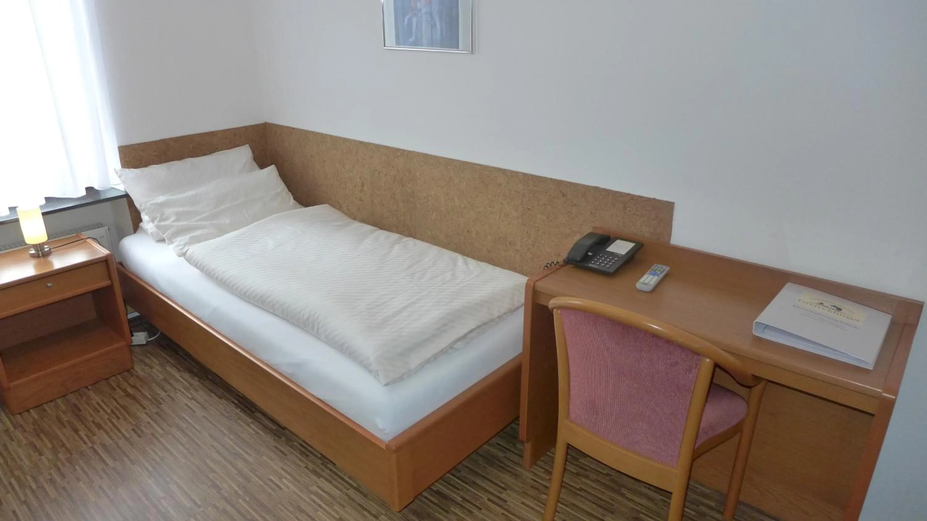 Bed in Central-Hotel Greiveldinger