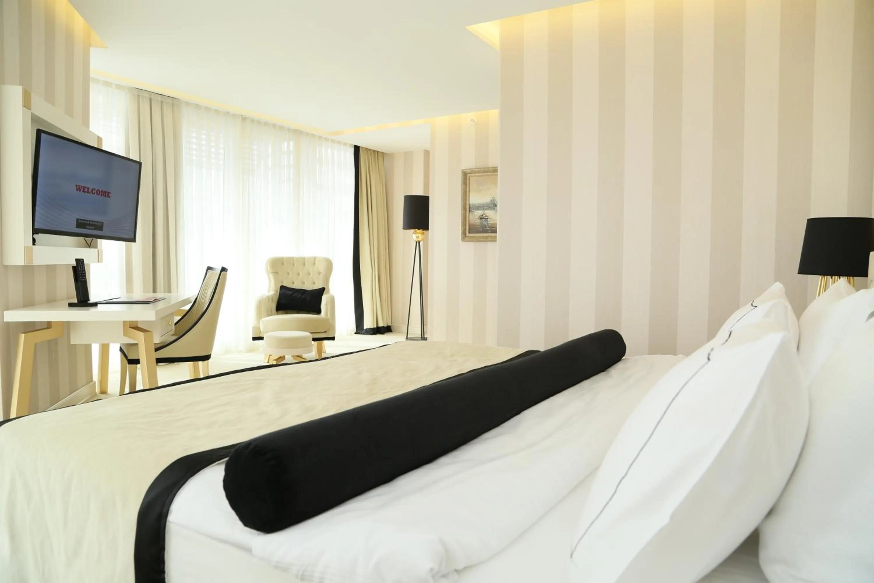 Seating area, Bed in Ramada Hotel & Suites Sisli