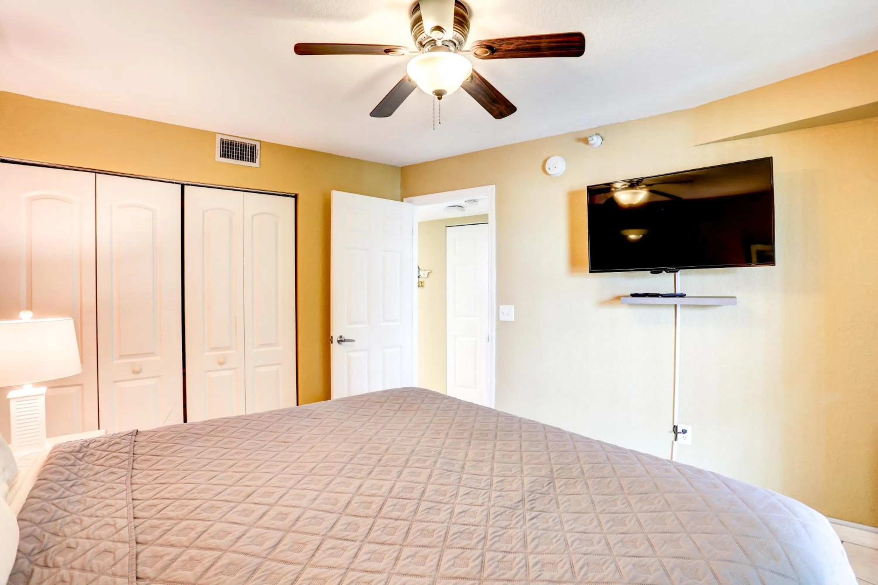 Bed in South Beach Condo Hotel by Travel Resort Services, Inc.