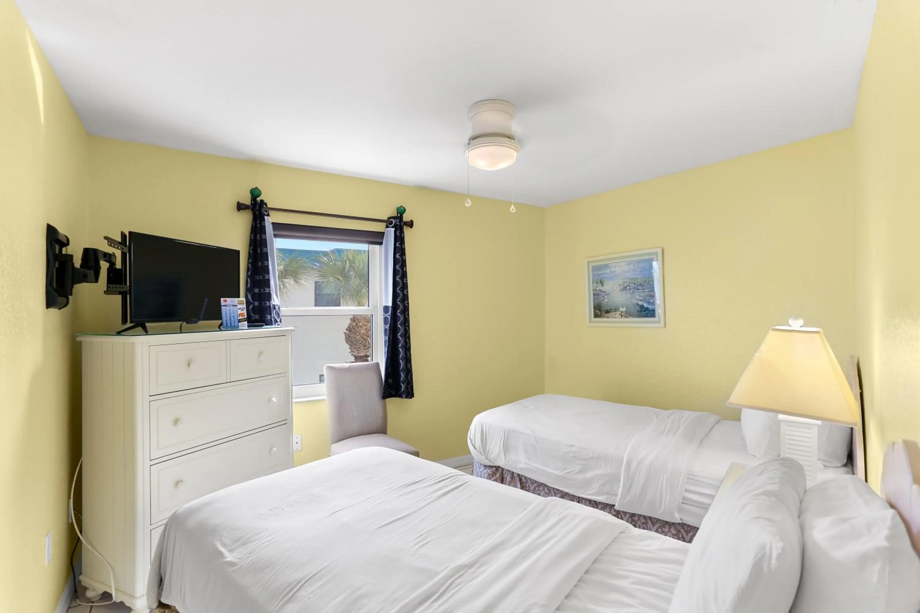 Bed in South Beach Condo Hotel by Travel Resort Services, Inc.