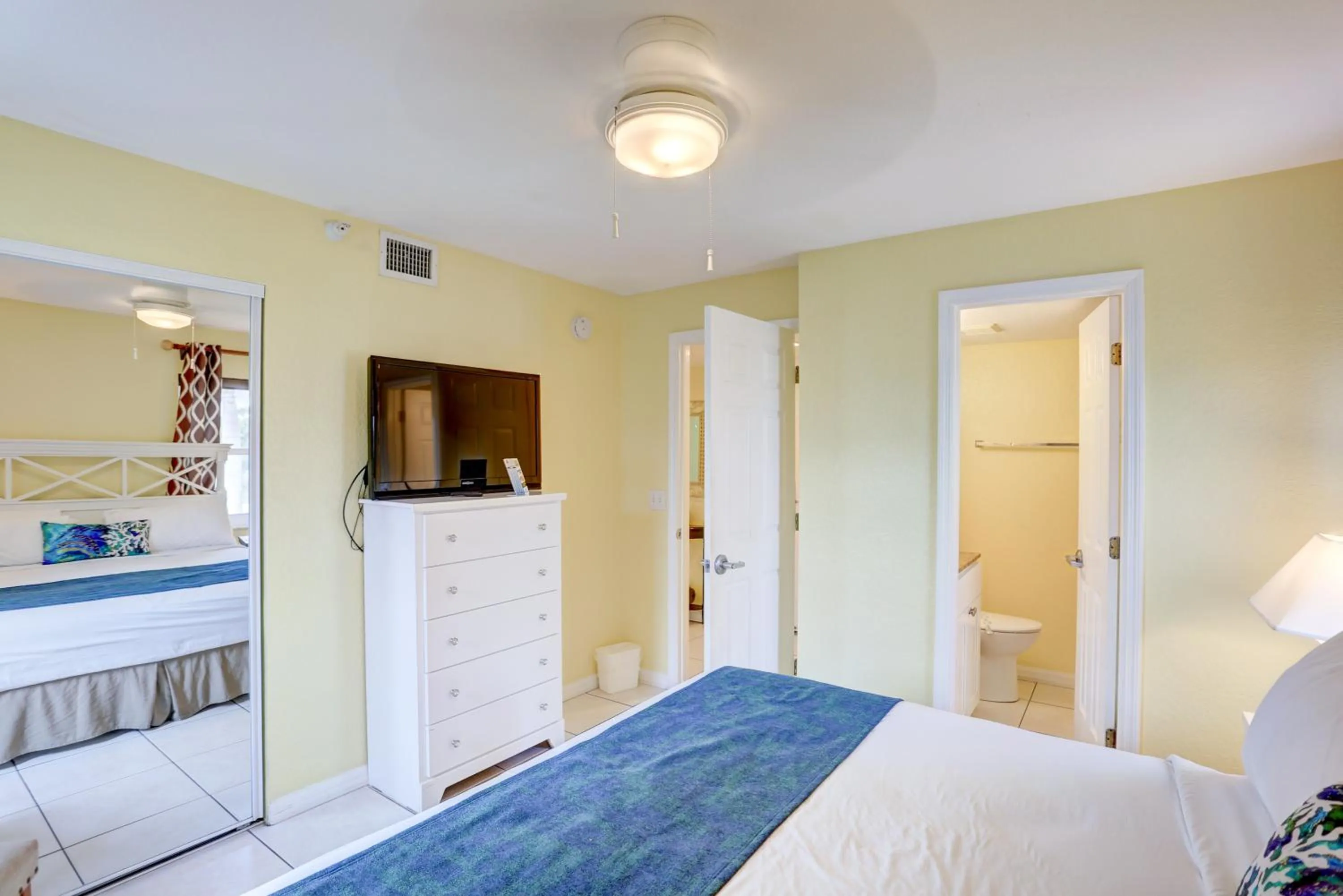 Bed in South Beach Condo Hotel by Travel Resort Services, Inc.