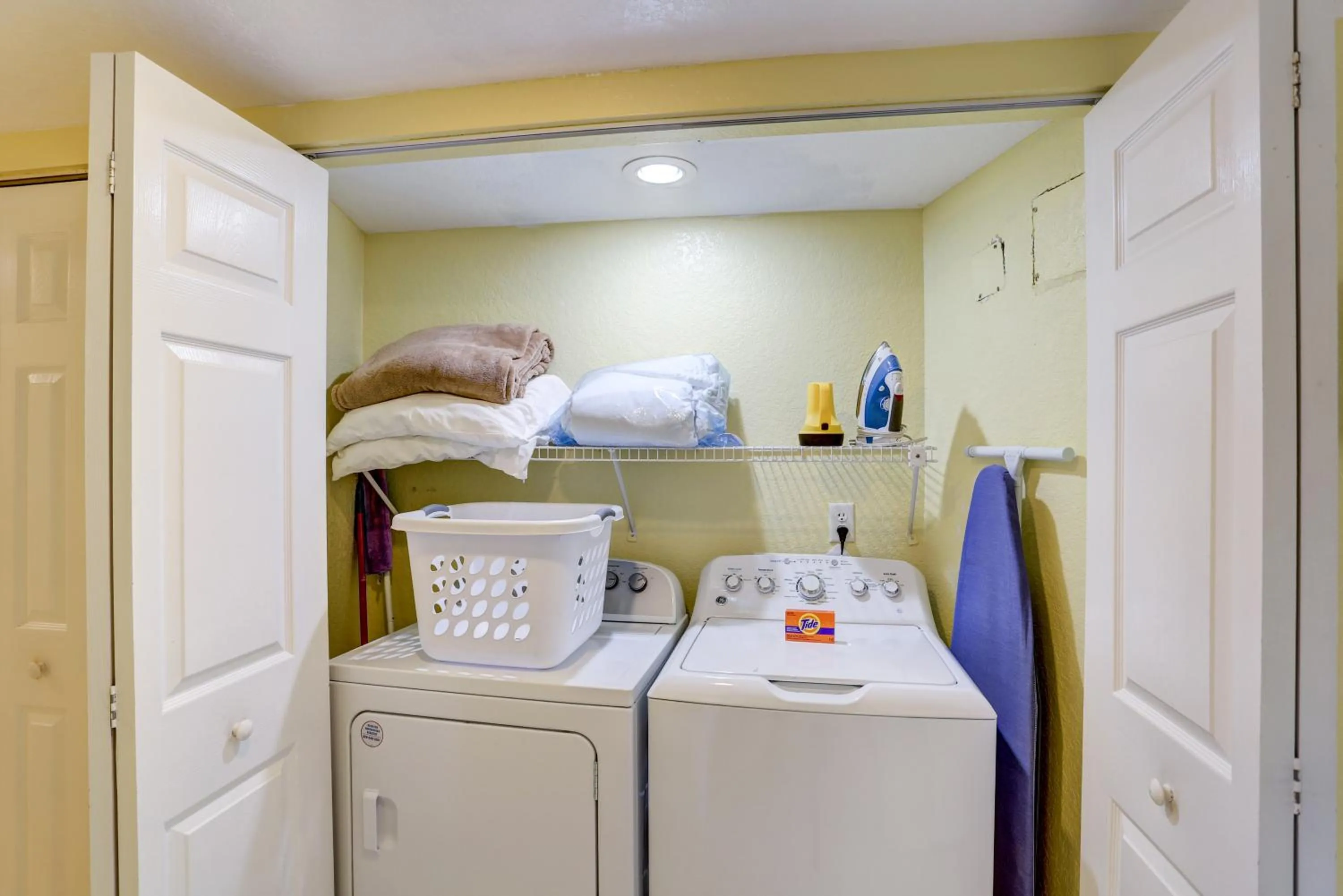 Bed in South Beach Condo Hotel by Travel Resort Services, Inc.