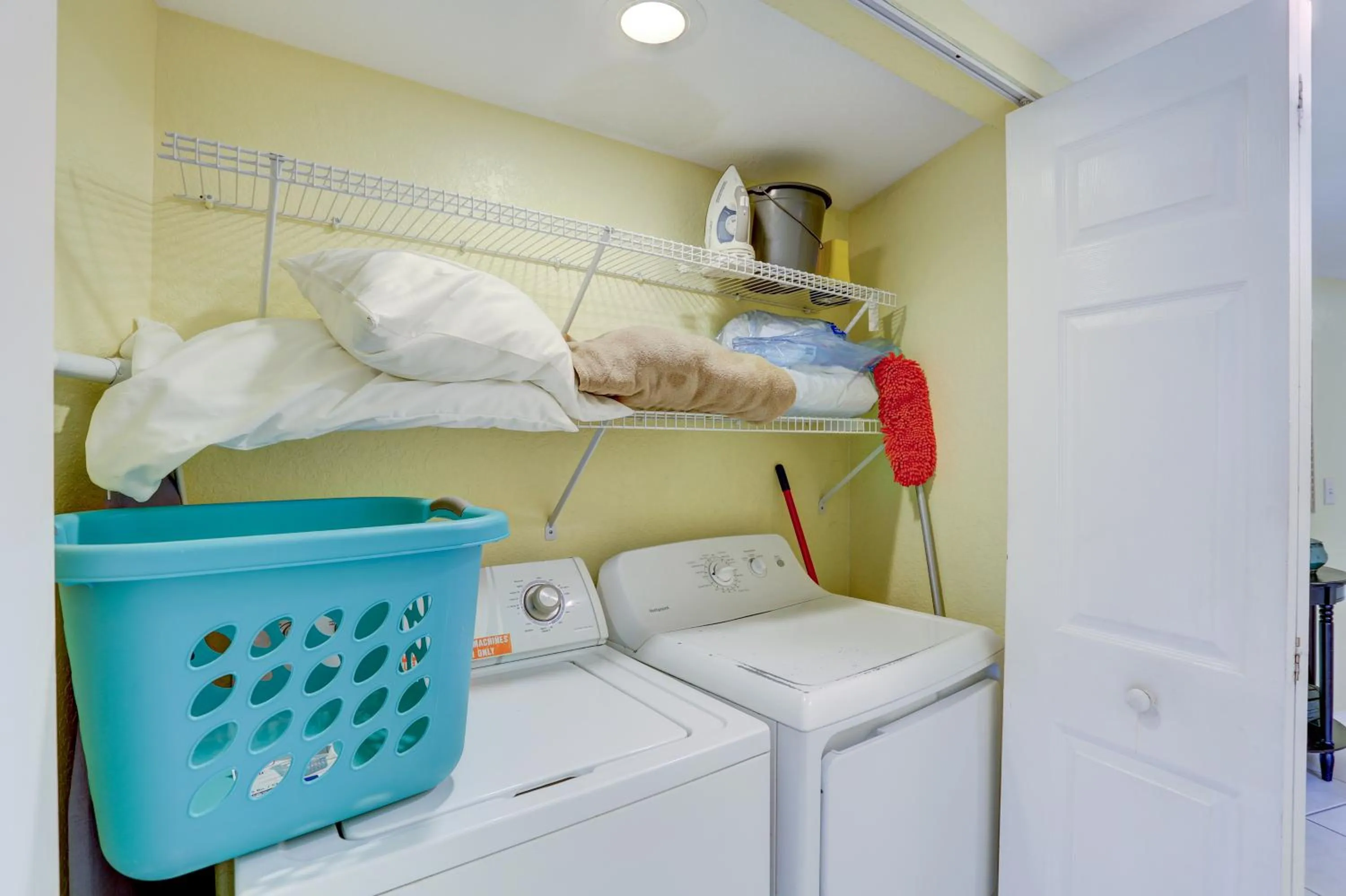 Bed in South Beach Condo Hotel by Travel Resort Services, Inc.