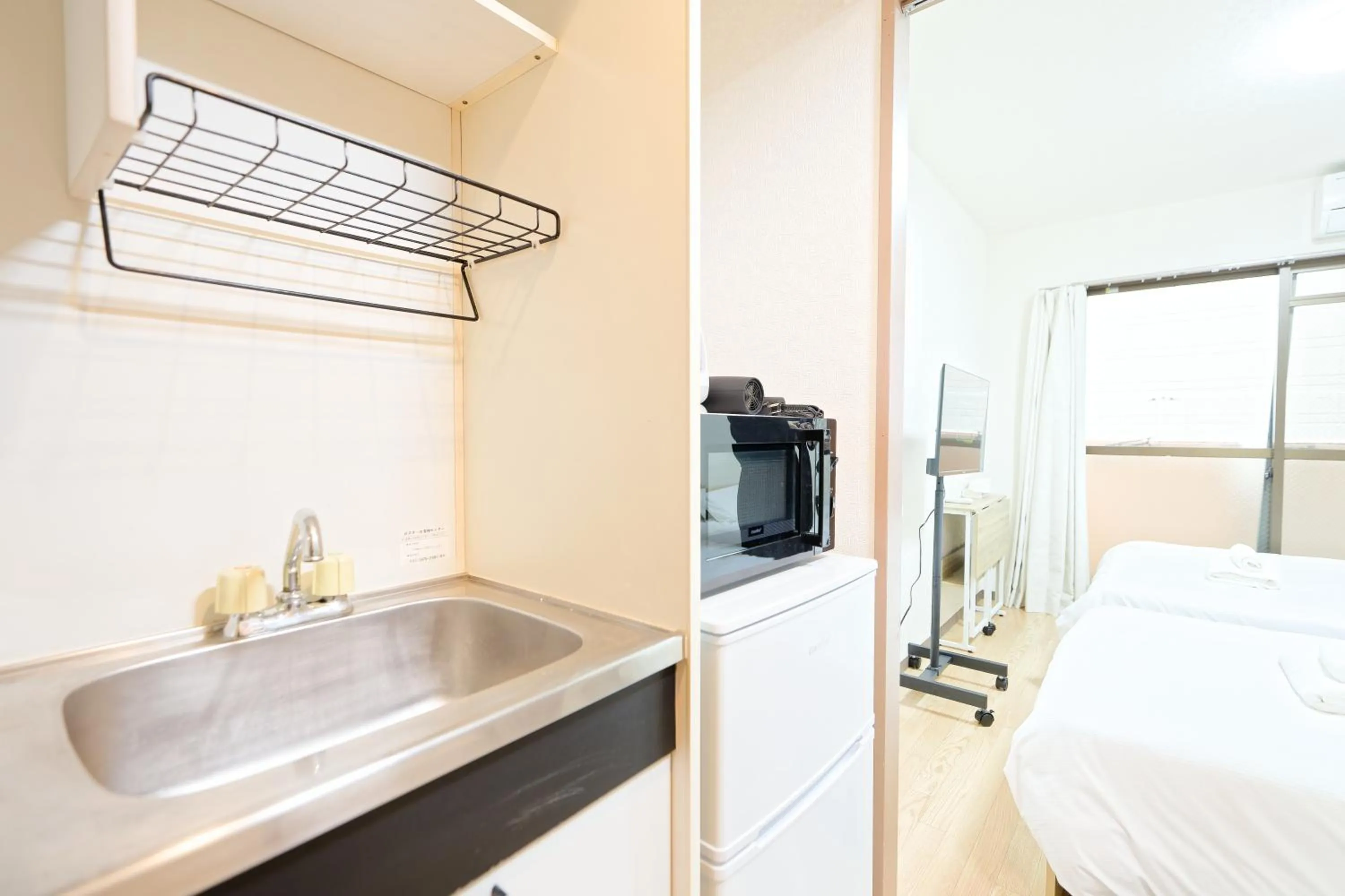 Bed in Shinjuku Waseda Earthtone Apartment