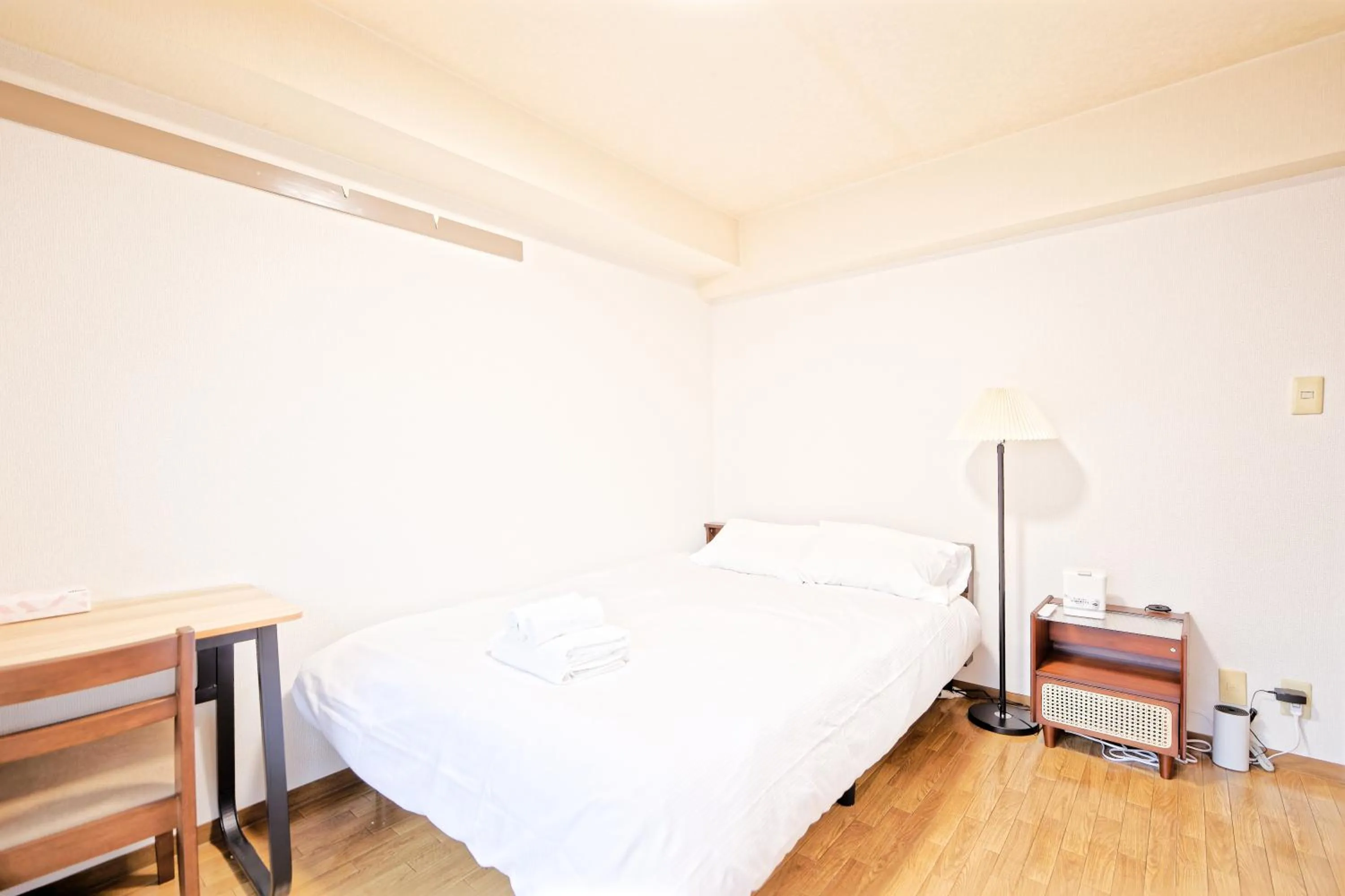 Bed in Shinjuku Waseda Earthtone Apartment