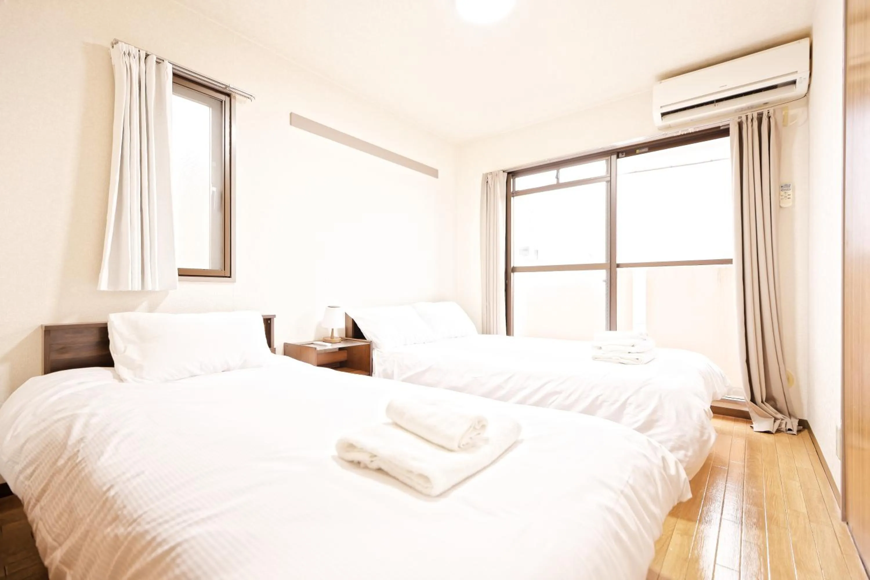 Bed in Shinjuku Waseda Earthtone Apartment