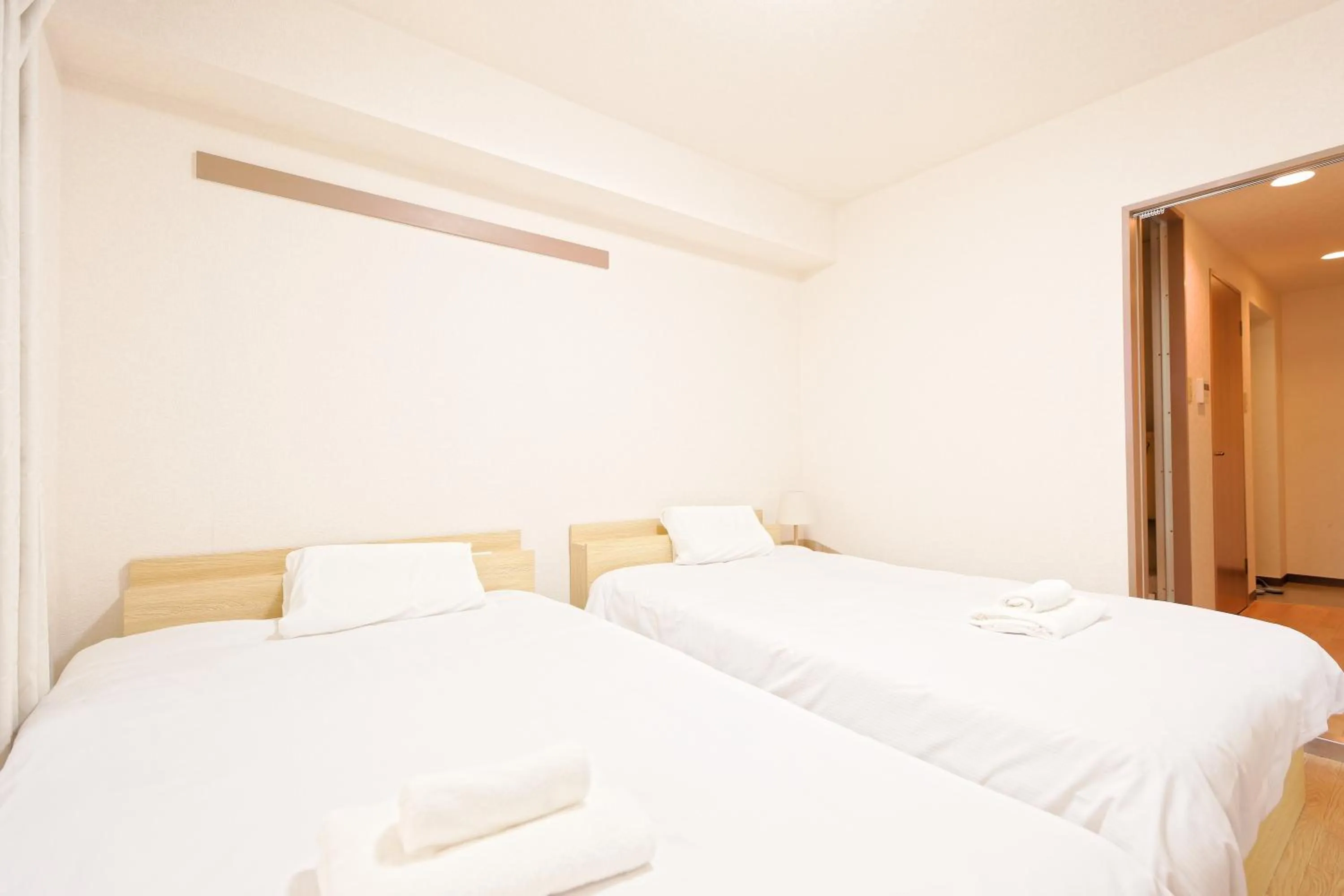 Bed in Shinjuku Waseda Earthtone Apartment