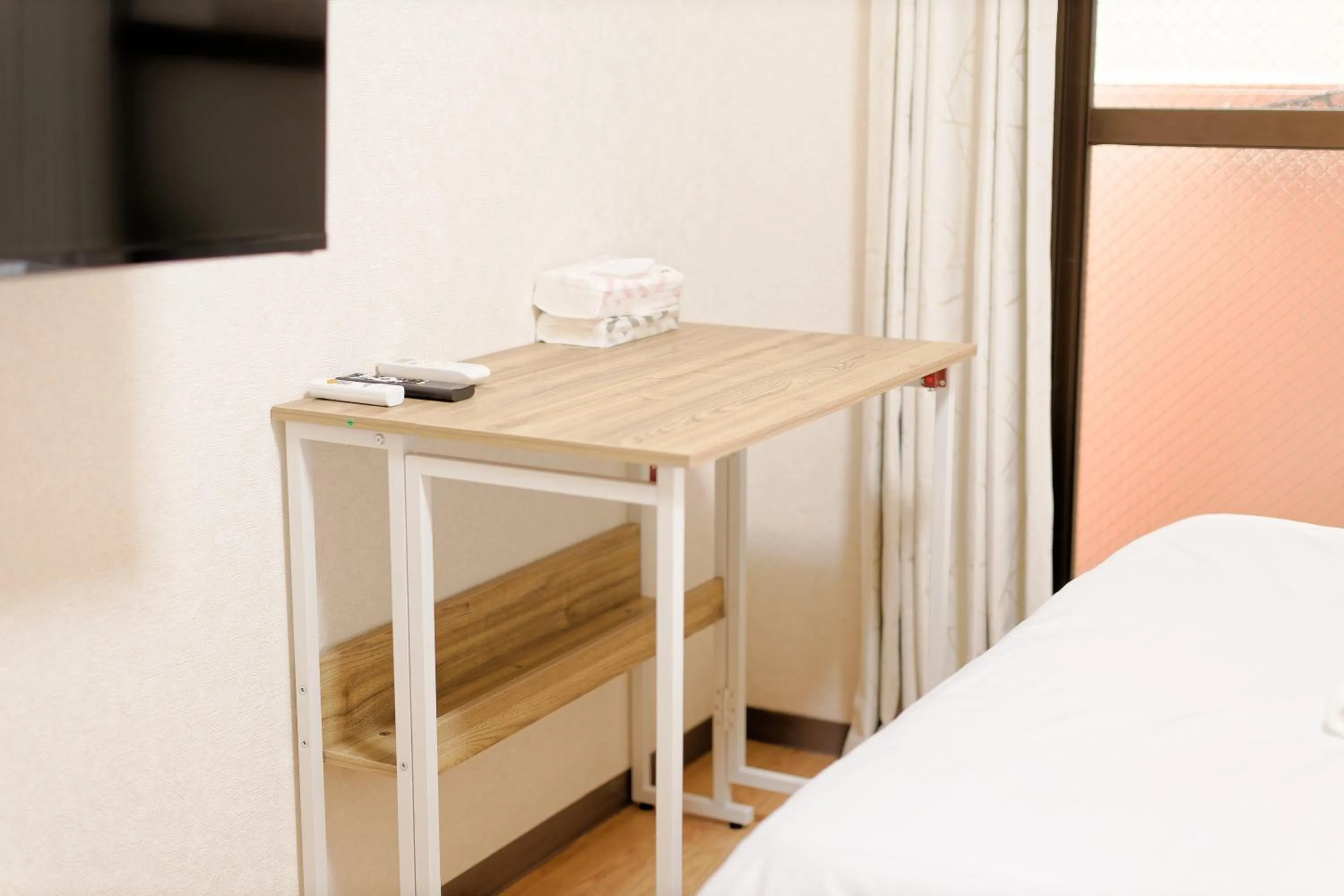 Bed in Shinjuku Waseda Earthtone Apartment