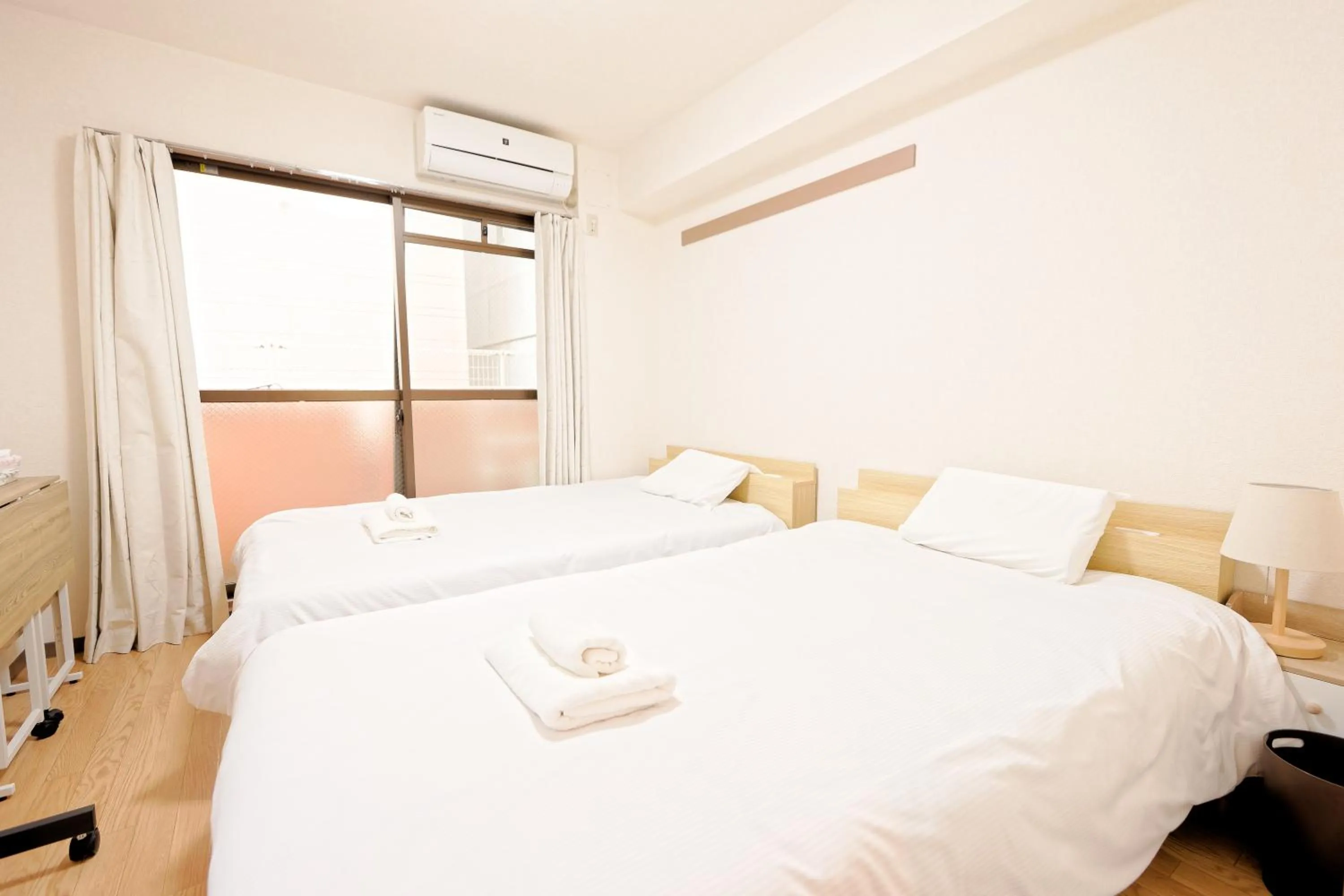 Bed in Shinjuku Waseda Earthtone Apartment