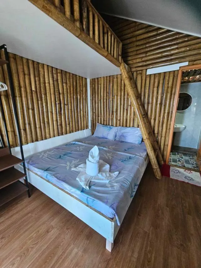 Bed in Tambayan Rooms and Cottages by SMS Hospitality