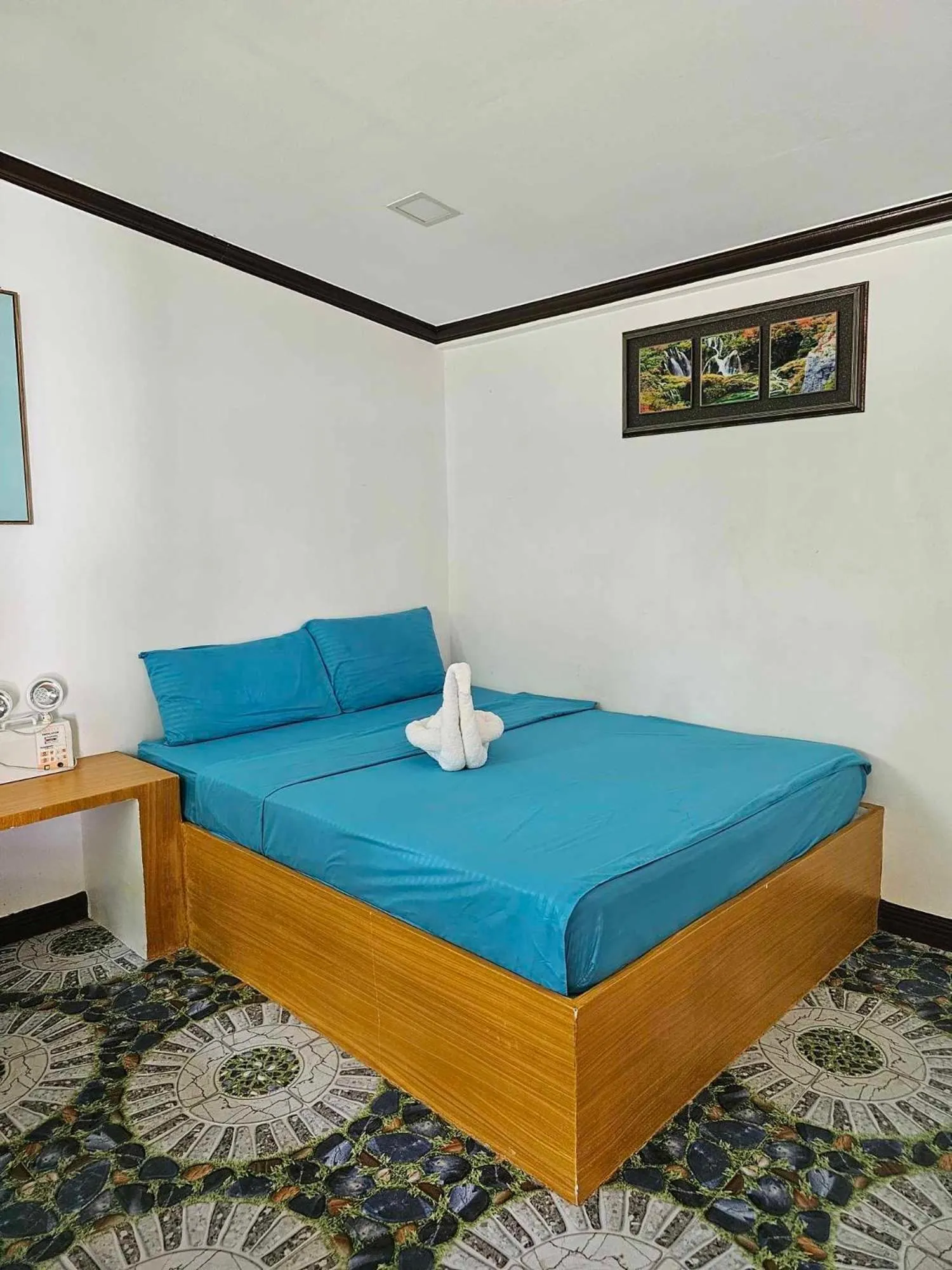Bed in Tambayan Rooms and Cottages by SMS Hospitality