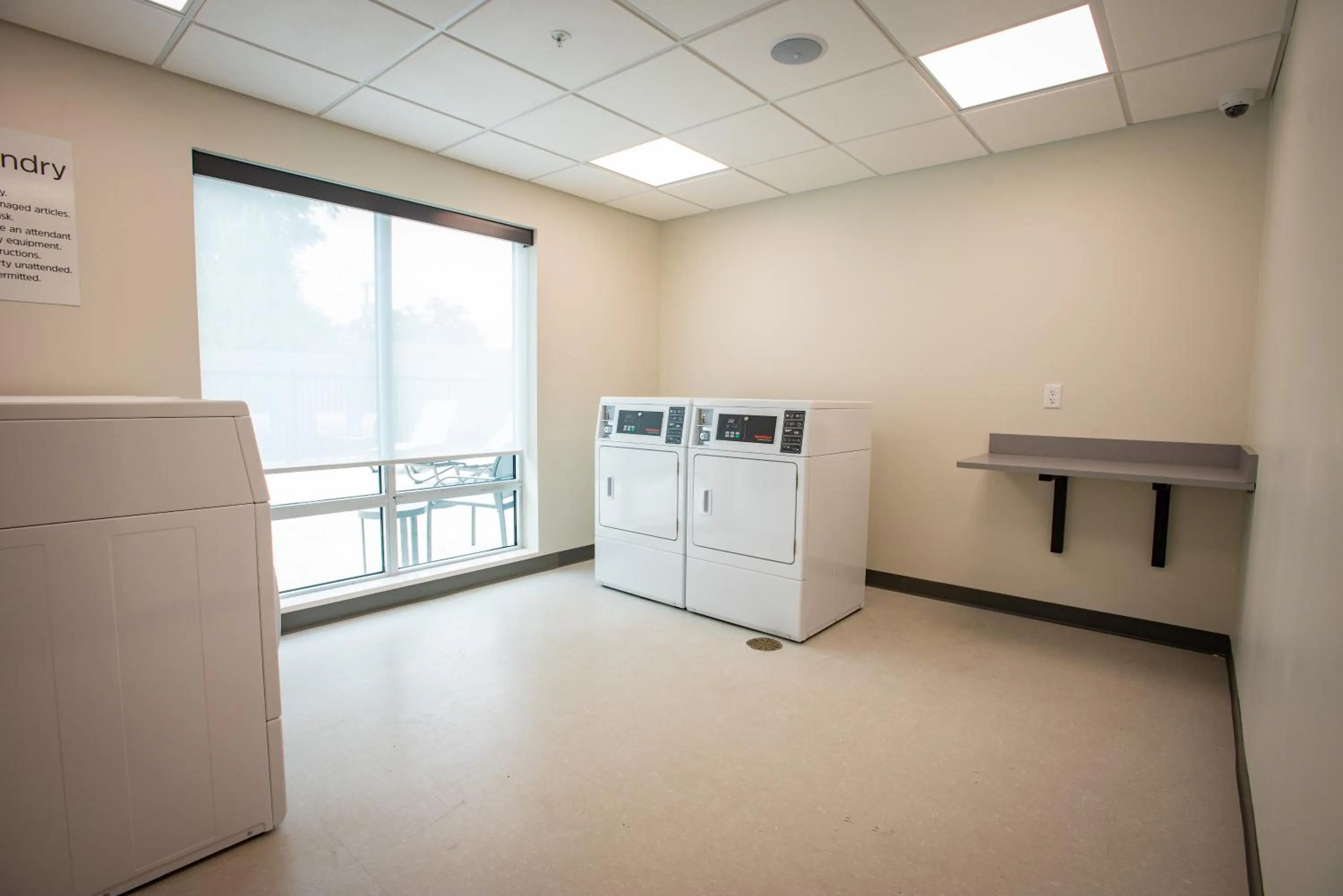 laundry in Holiday Inn Express & Suites Pensacola Airport North – I-10 by IHG