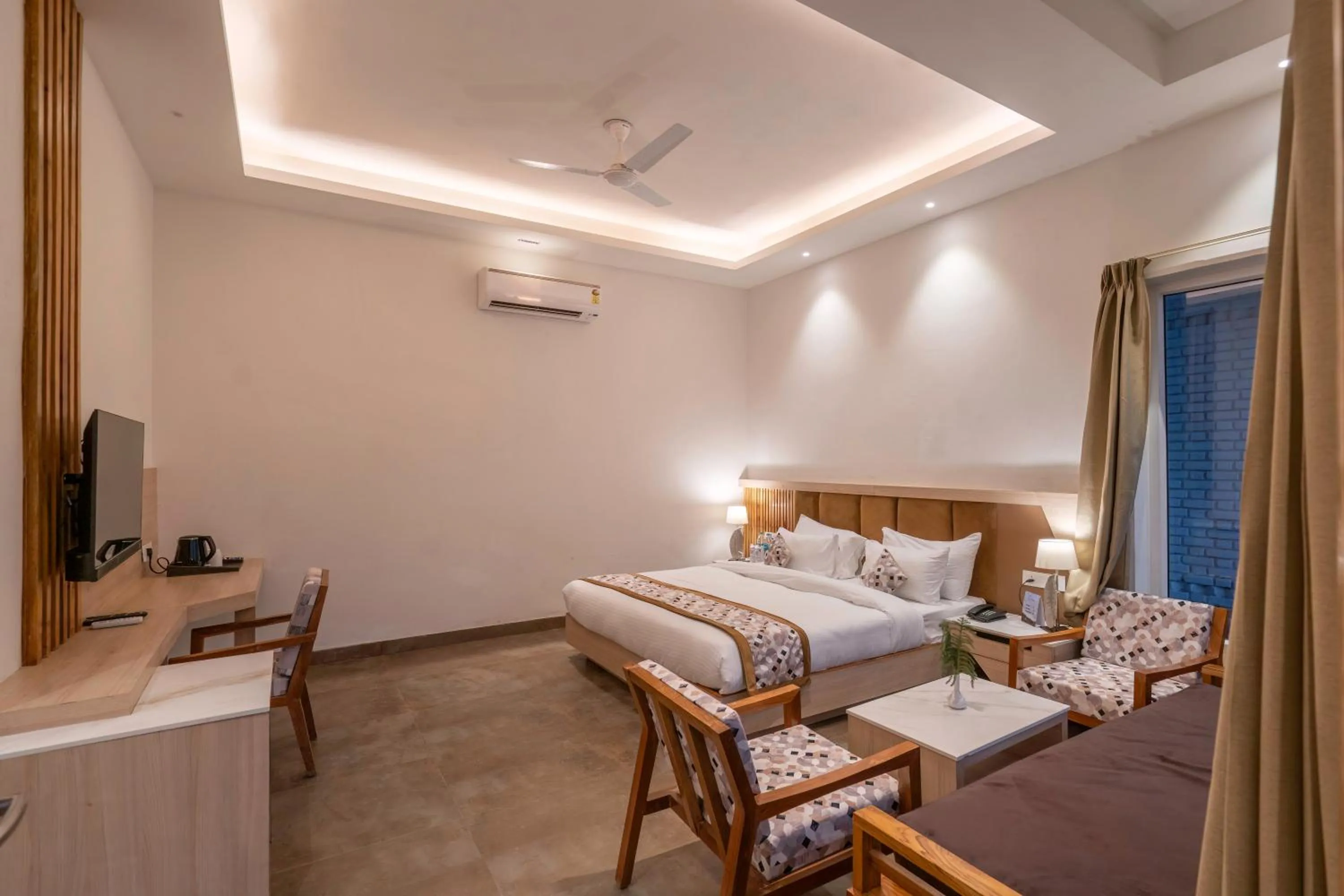 Bed in Evara Spa & Resort