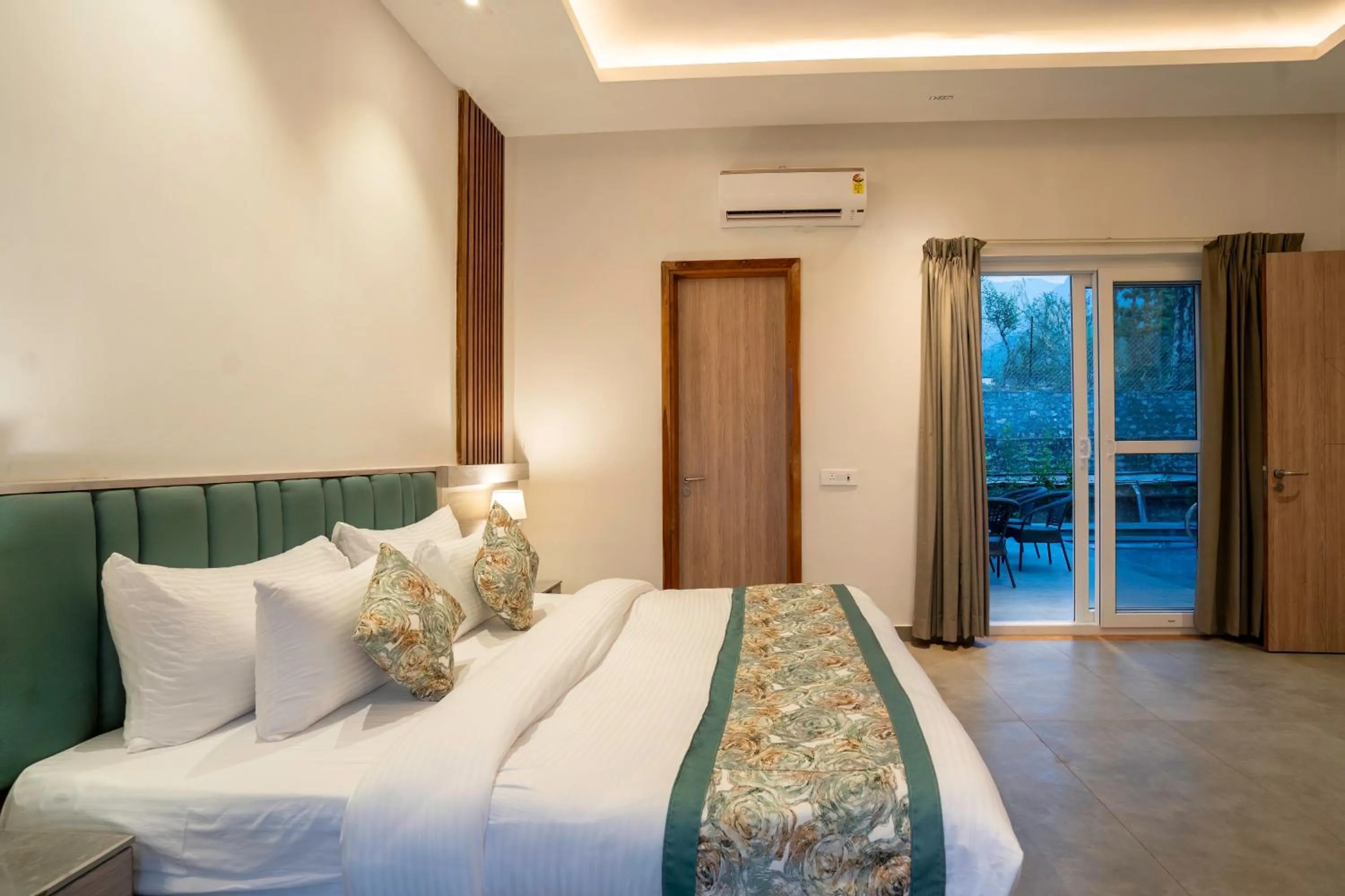 Bed in Evara Spa & Resort