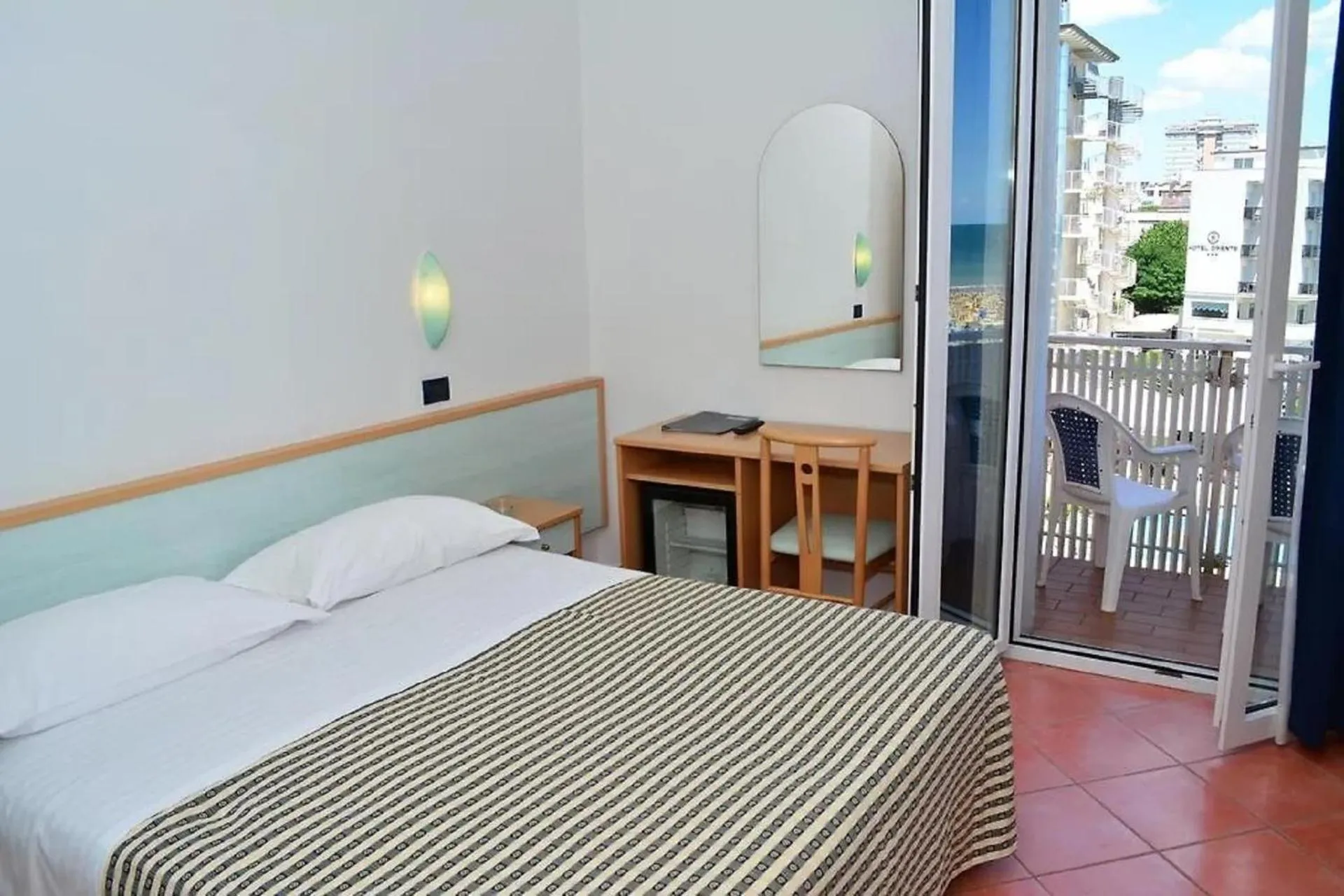 View (from property/room), Bed in Hotel Delfino