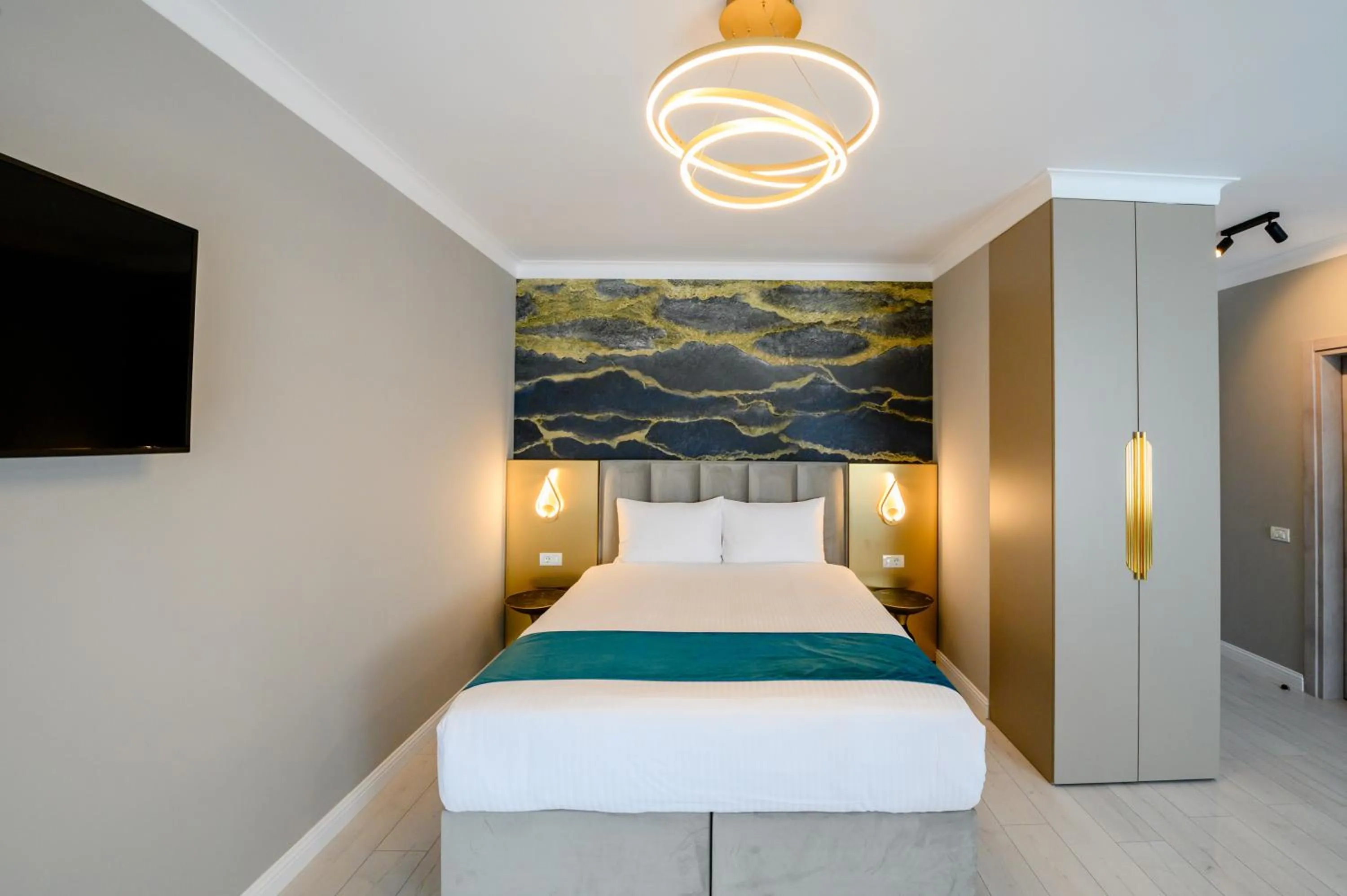 Bed in Elitte Inn & Suites