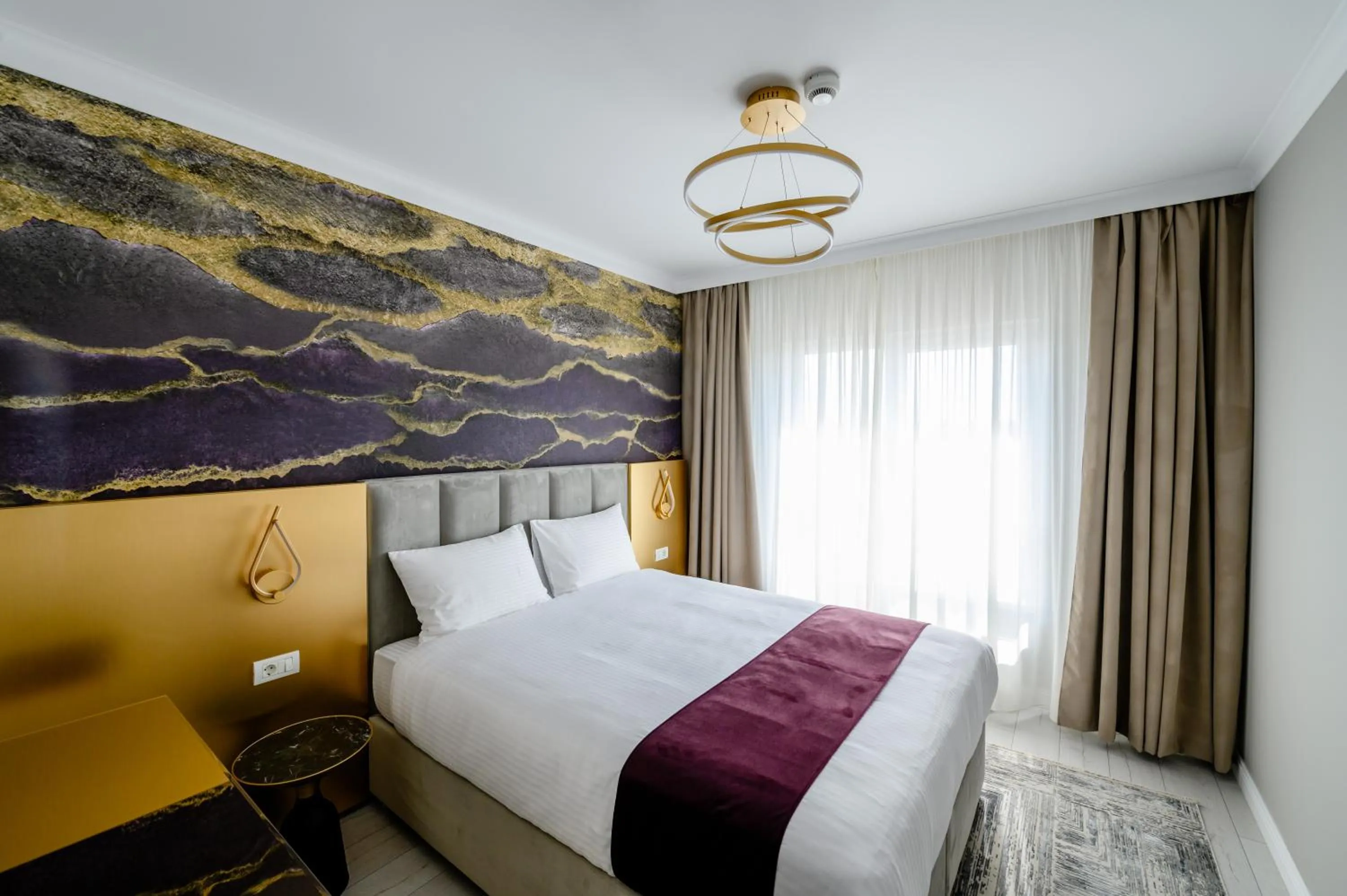 Bed in Elitte Inn & Suites