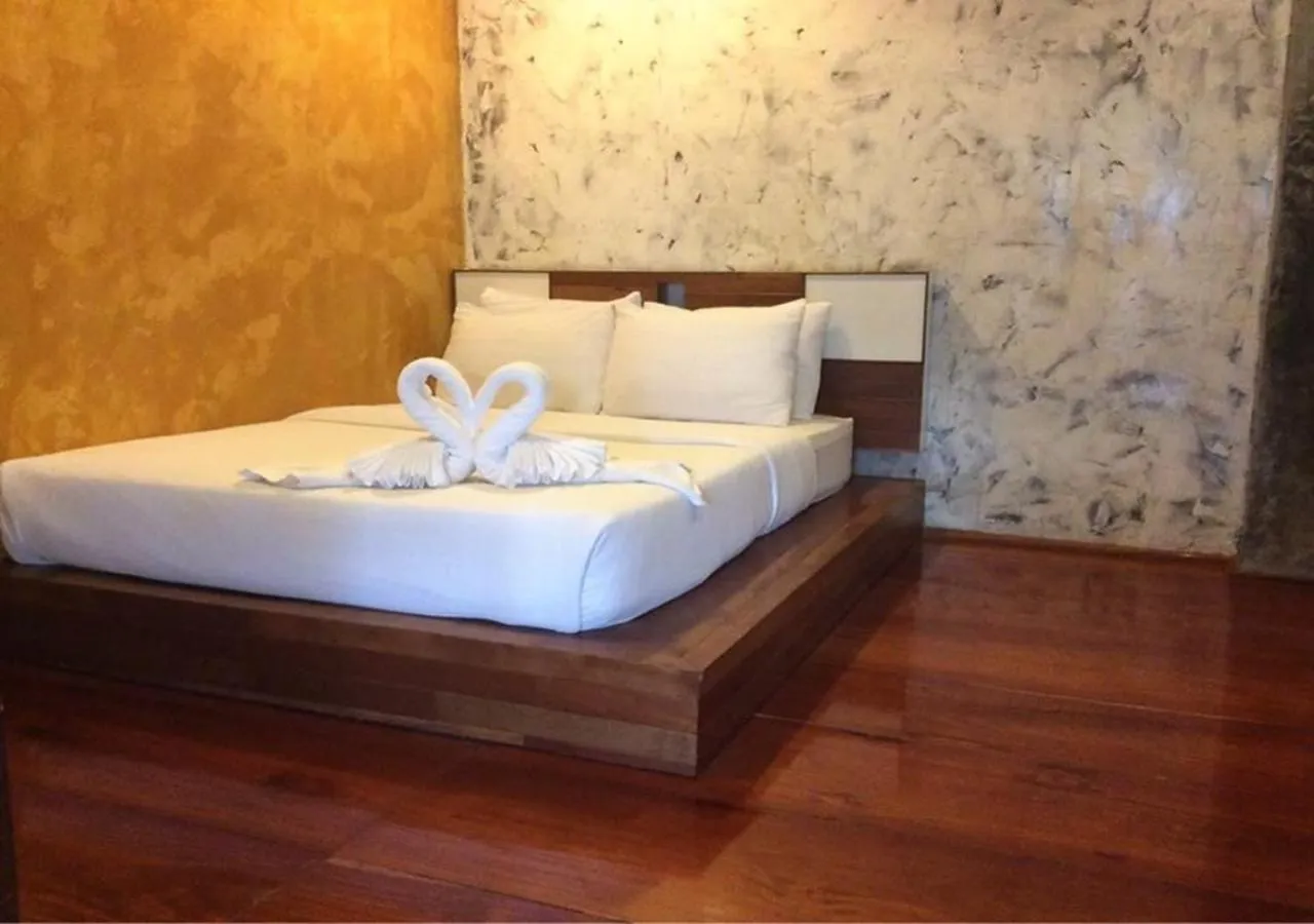 Bed in BaanChompooAmphawa